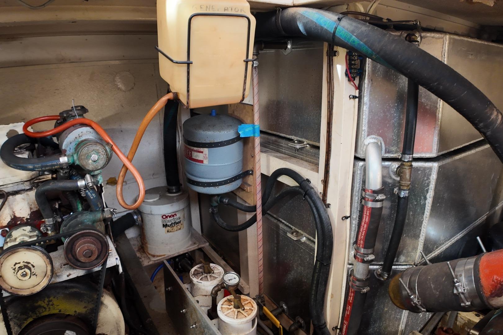 Engine room of a 1978 Grand Banks 42 Classic boat, showcasing mechanical components.