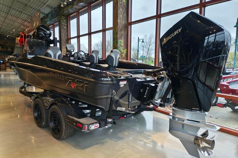 2026 Nitro ZV21 boat with Mercury engine displayed indoors.