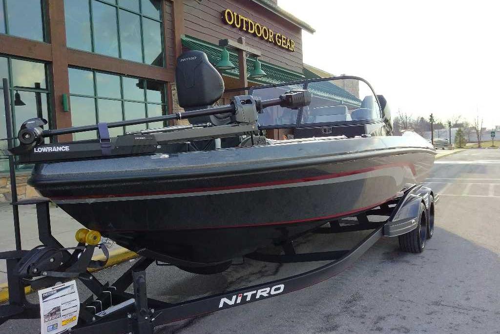 2024 Nitro ZV21 Pro fishing boat on trailer outside outdoor gear store.