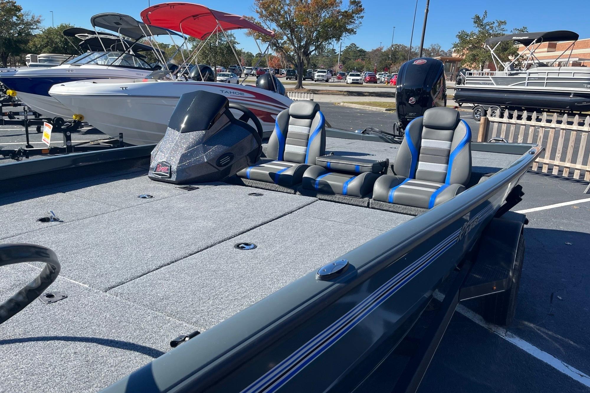 2025 Ranger RT188P boat with dual seats, parked in a marina with other boats.