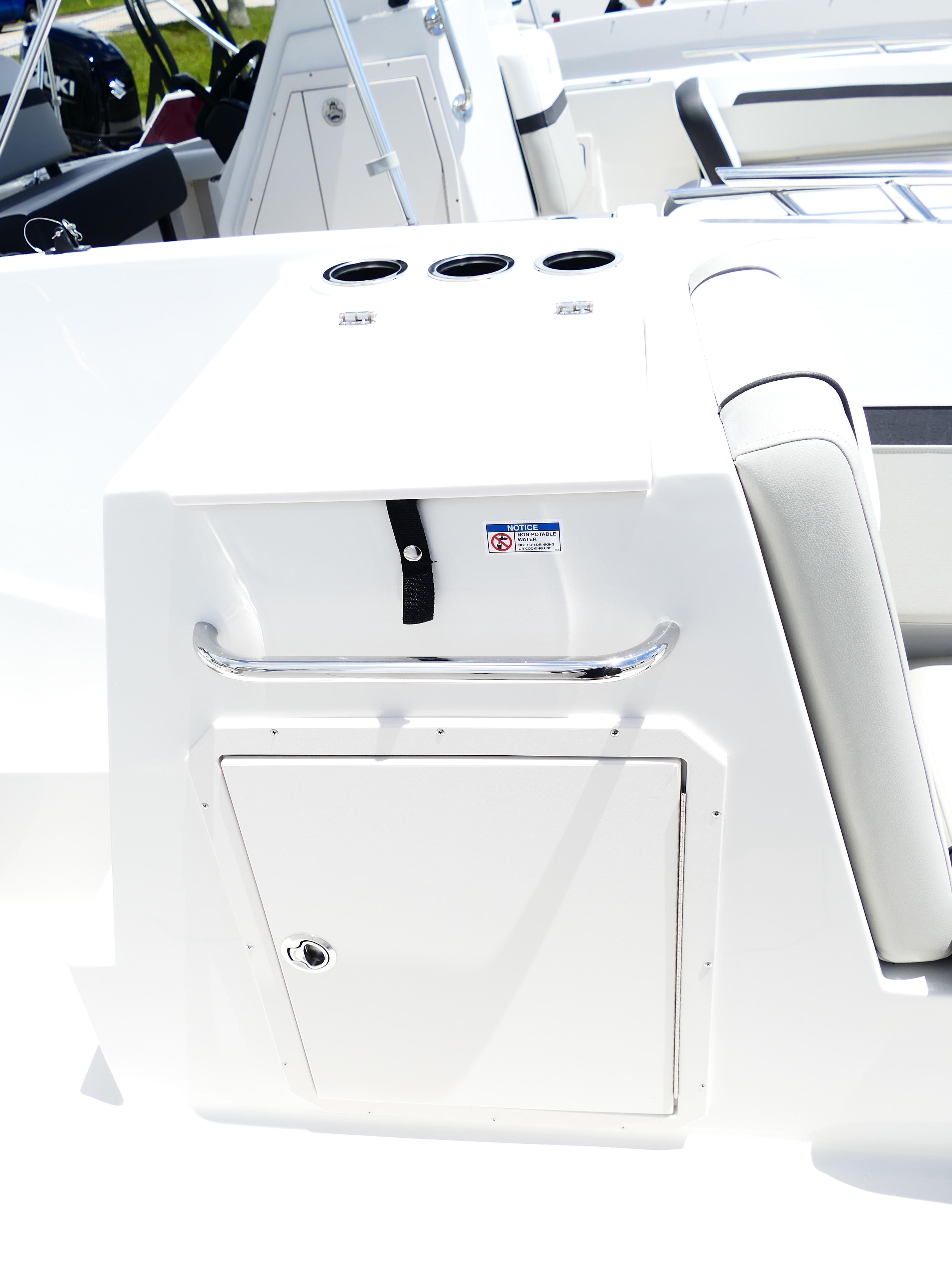 2026 Starcraft SVX 231 OB DH boat interior with storage compartment and seating.