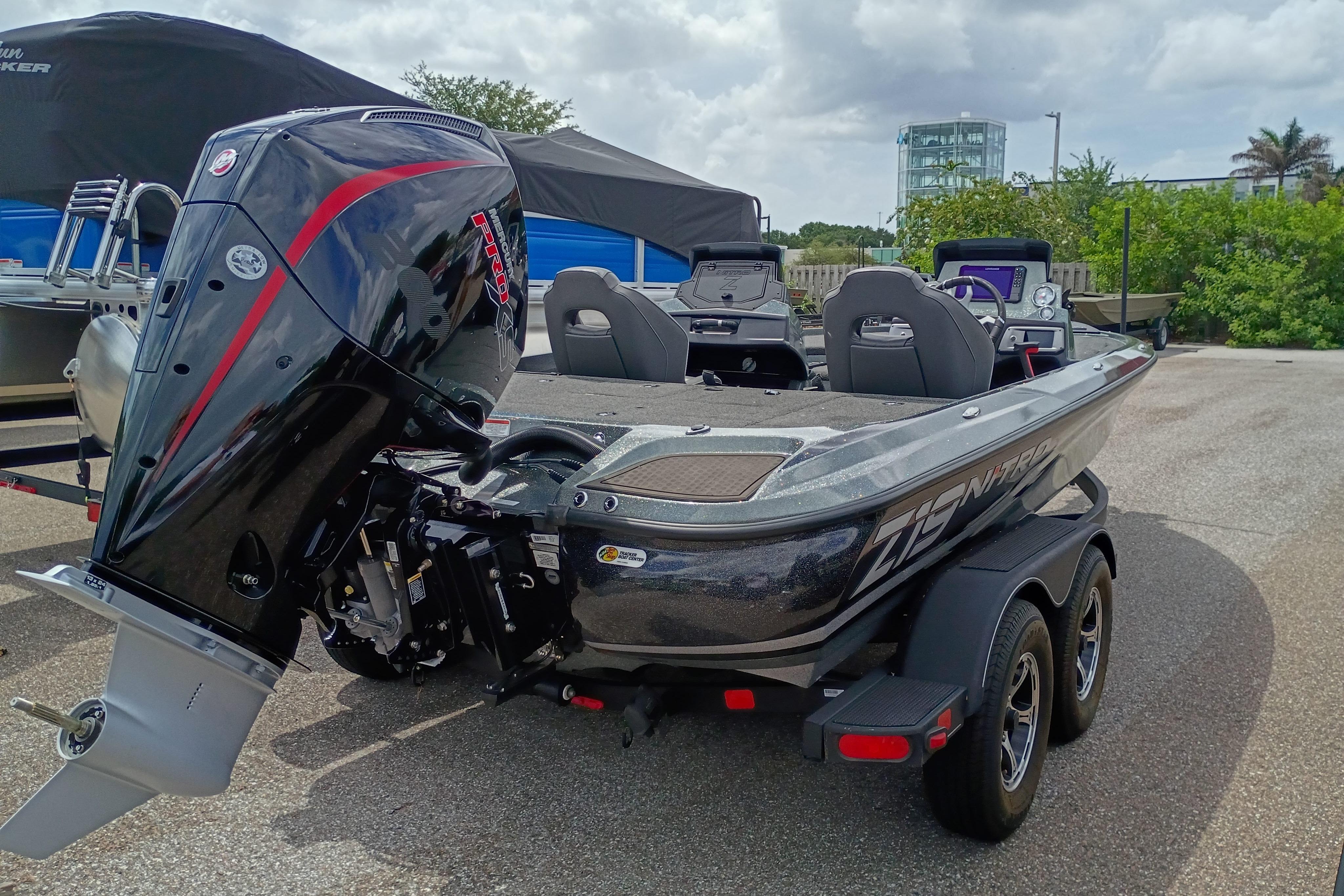 2024 Nitro Z19 Pro boat with powerful outboard motor, parked on a trailer.