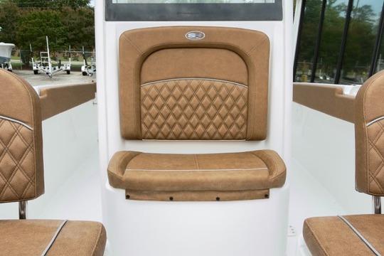 2026 Sea Hunt Ultra 255 SE boat interior with tan diamond-stitched seating.
