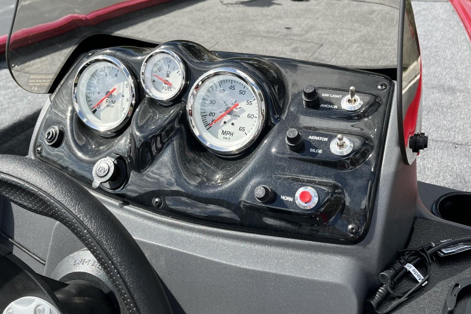 Dashboard of 2026 Tracker Pro 170 boat with gauges and control switches.