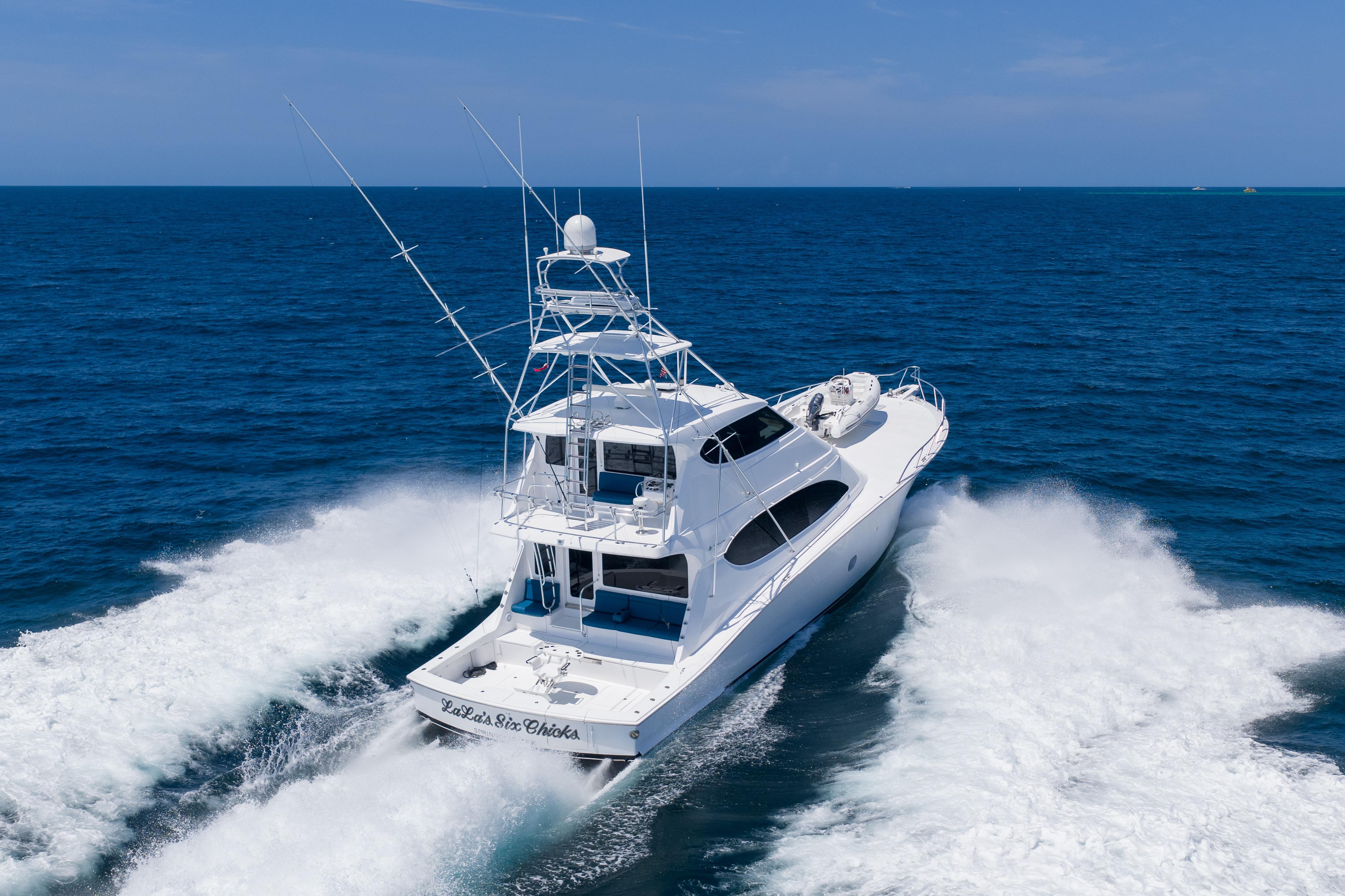 2008 Hatteras 77 Convertible yacht cruising on open ocean waters.