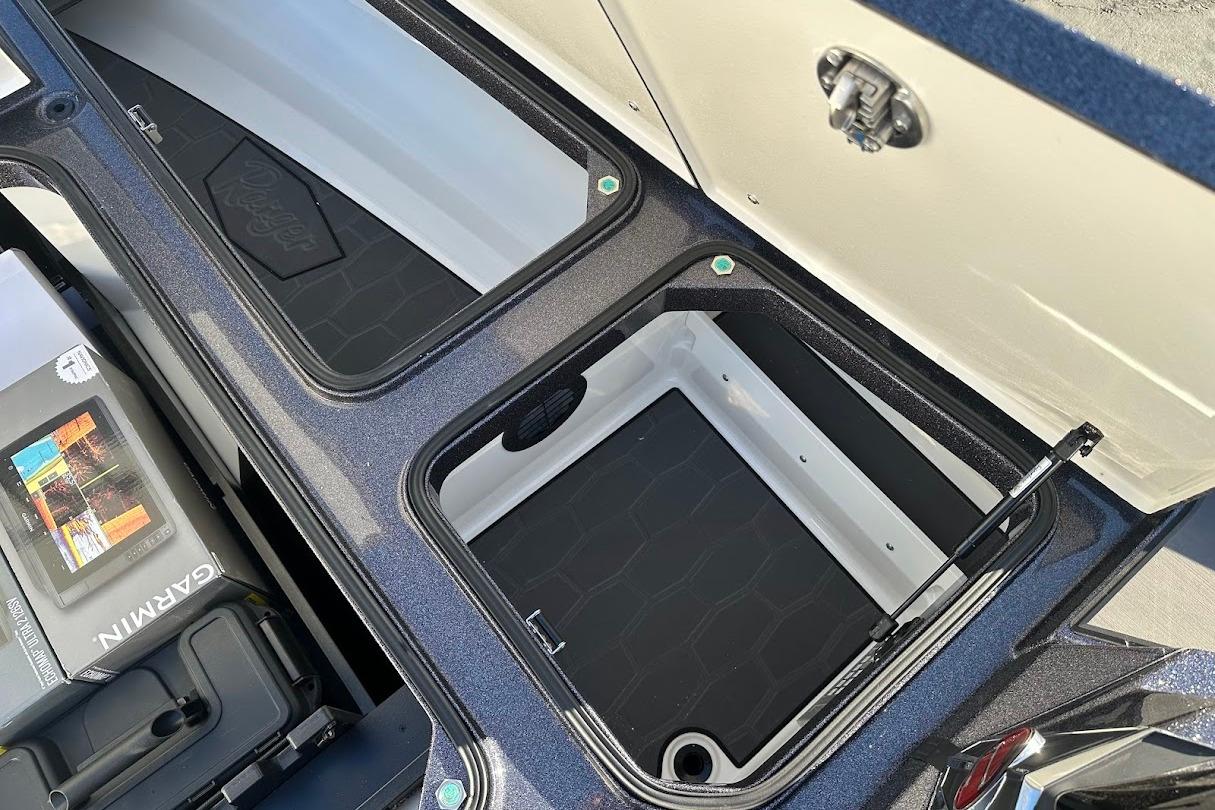 Open storage compartments in a 2026 Ranger Z521R Garmin Cup-Equipped boat.