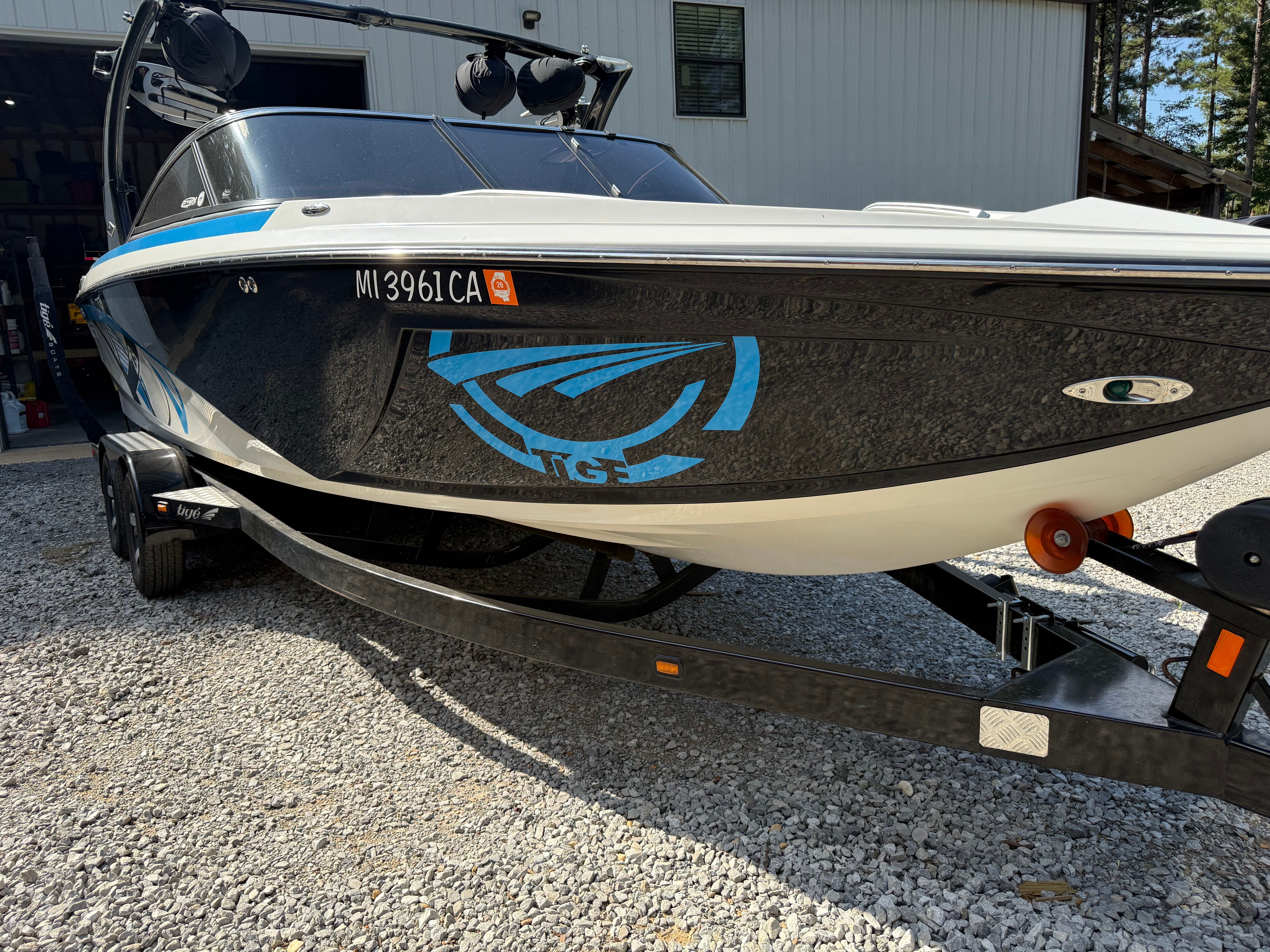 Custom Z3 boat from 2012 on trailer, side view.