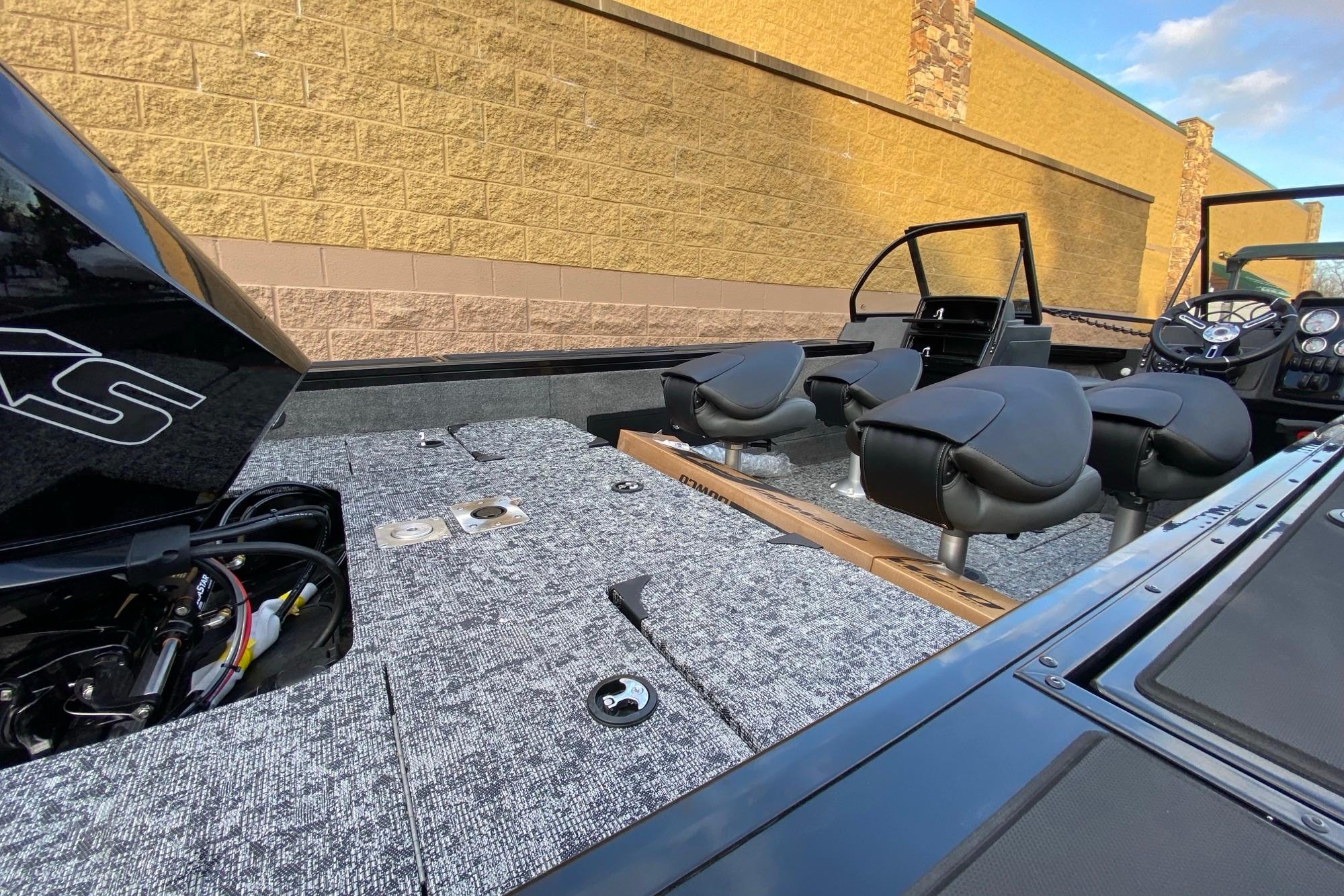 2026 Tracker Targa V-18 Combo boat interior with seating and control panel.