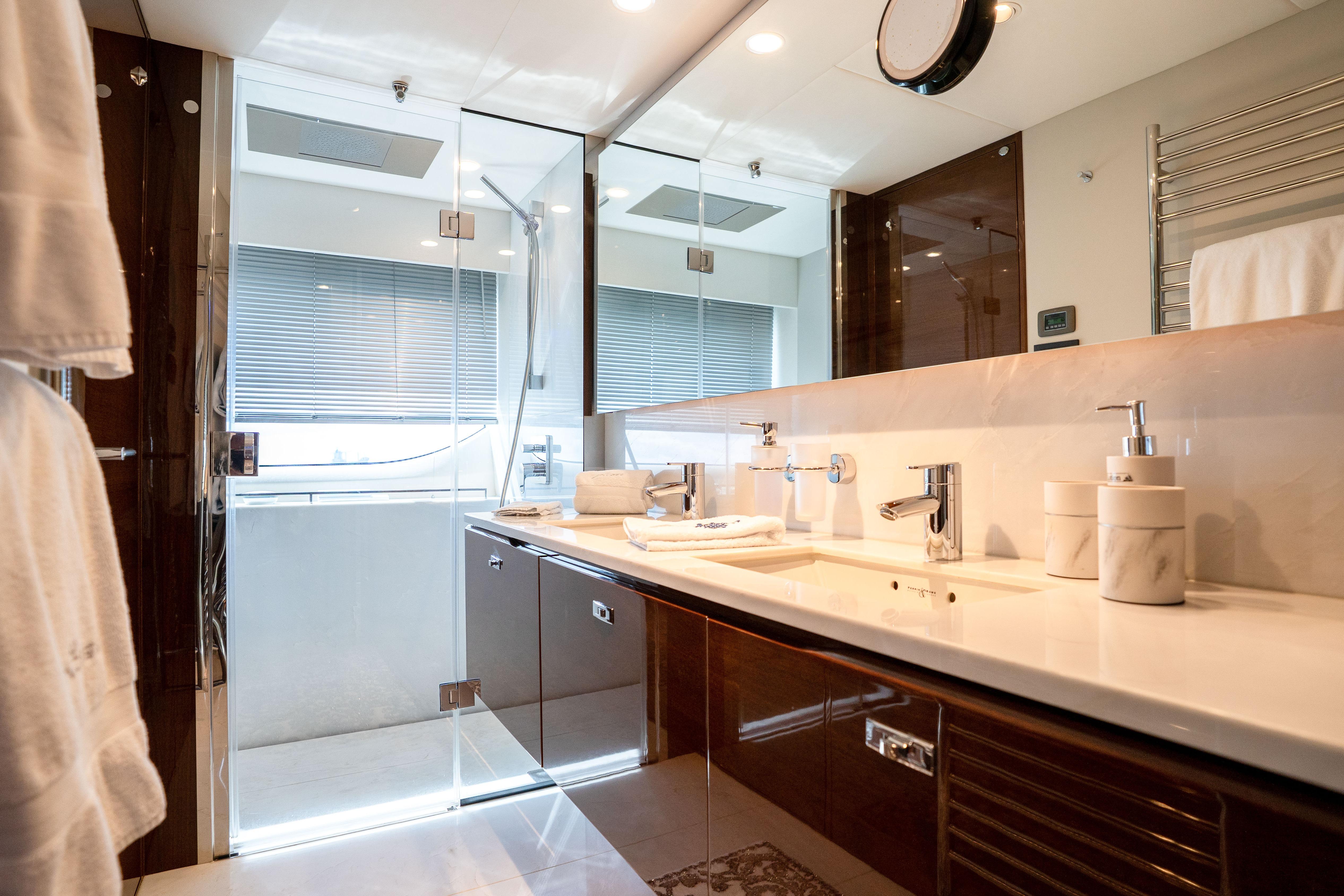 Luxurious bathroom on 2020 Princess Y85 yacht with modern fixtures and elegant design.