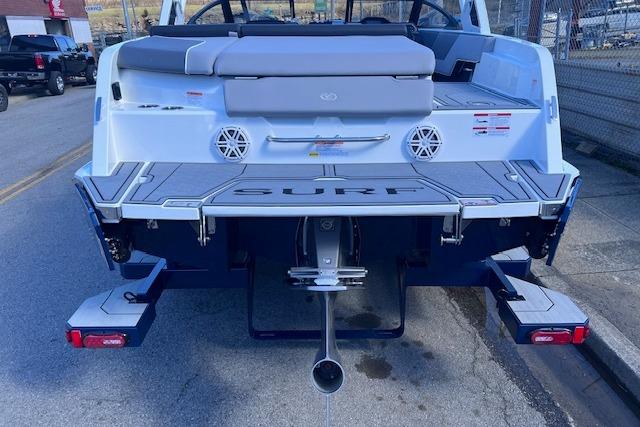 2025 Cobalt CS23 Surf boat rear view with swim platform and speakers.