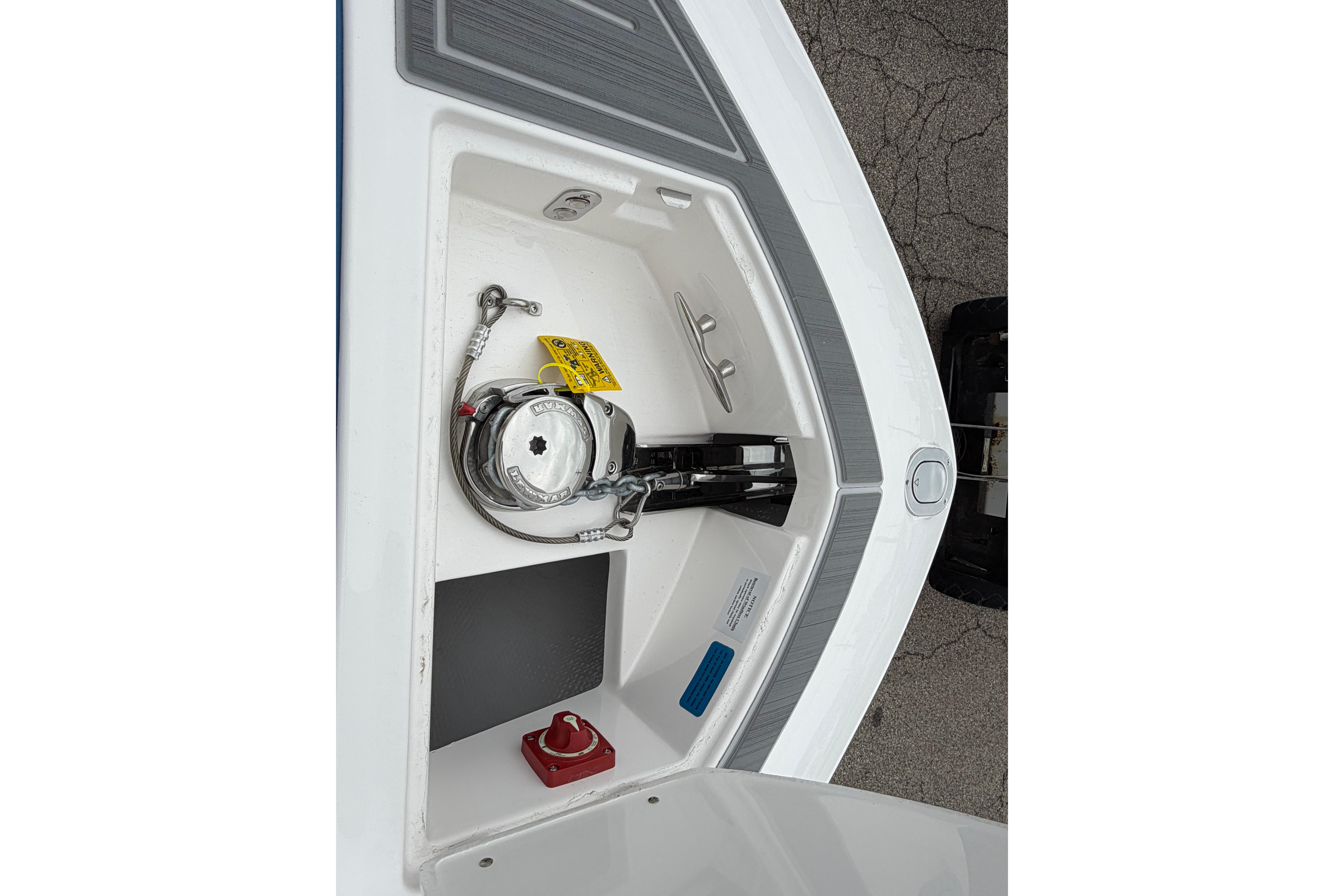 2026 Regal LS9 Surf boat anchor compartment with winch and cleat.
