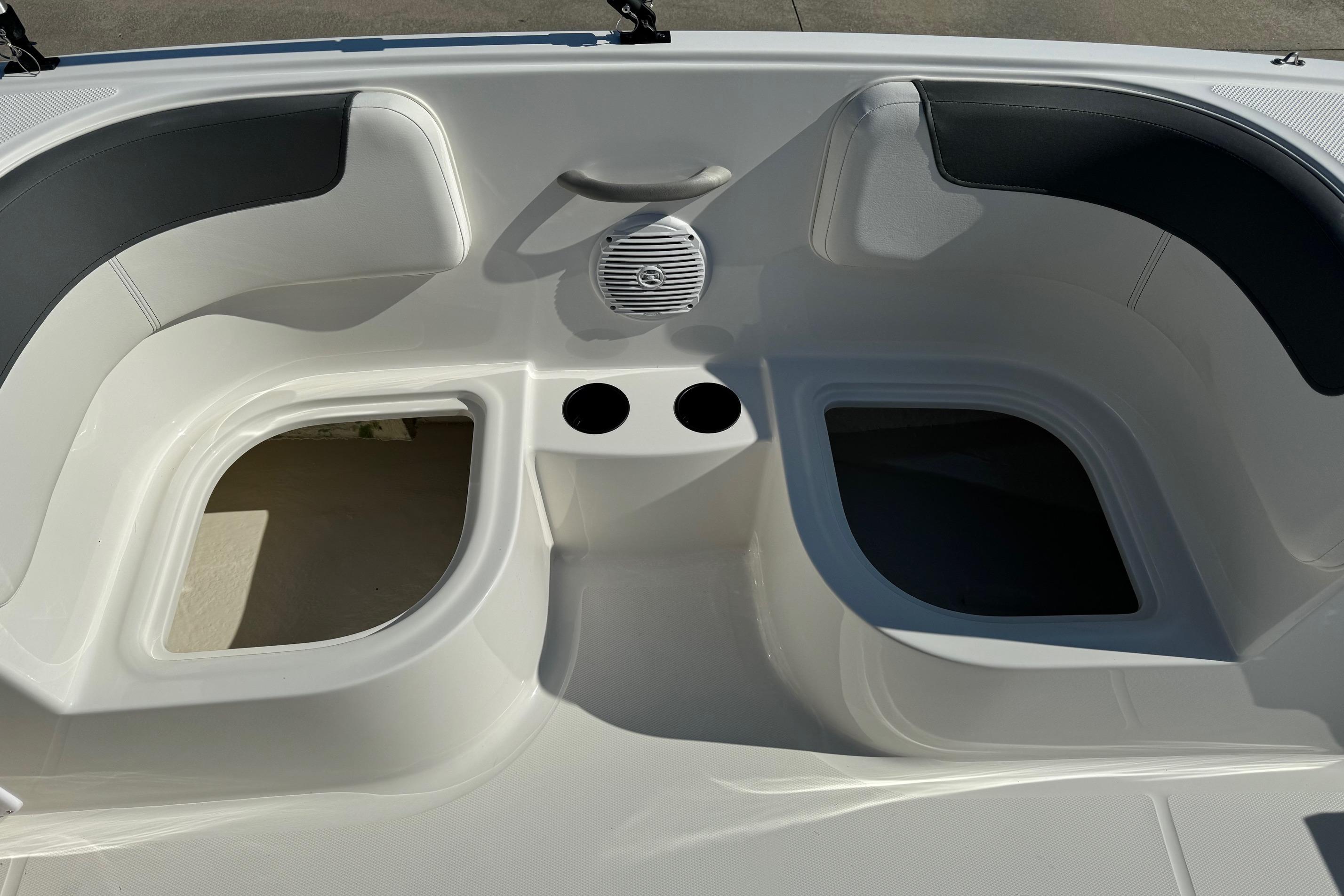 2025 Bayliner Element E16 boat interior with seating and cup holders.