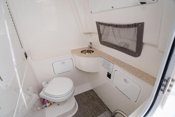 2025 Regulator 28 yacht interior with toilet and sink.