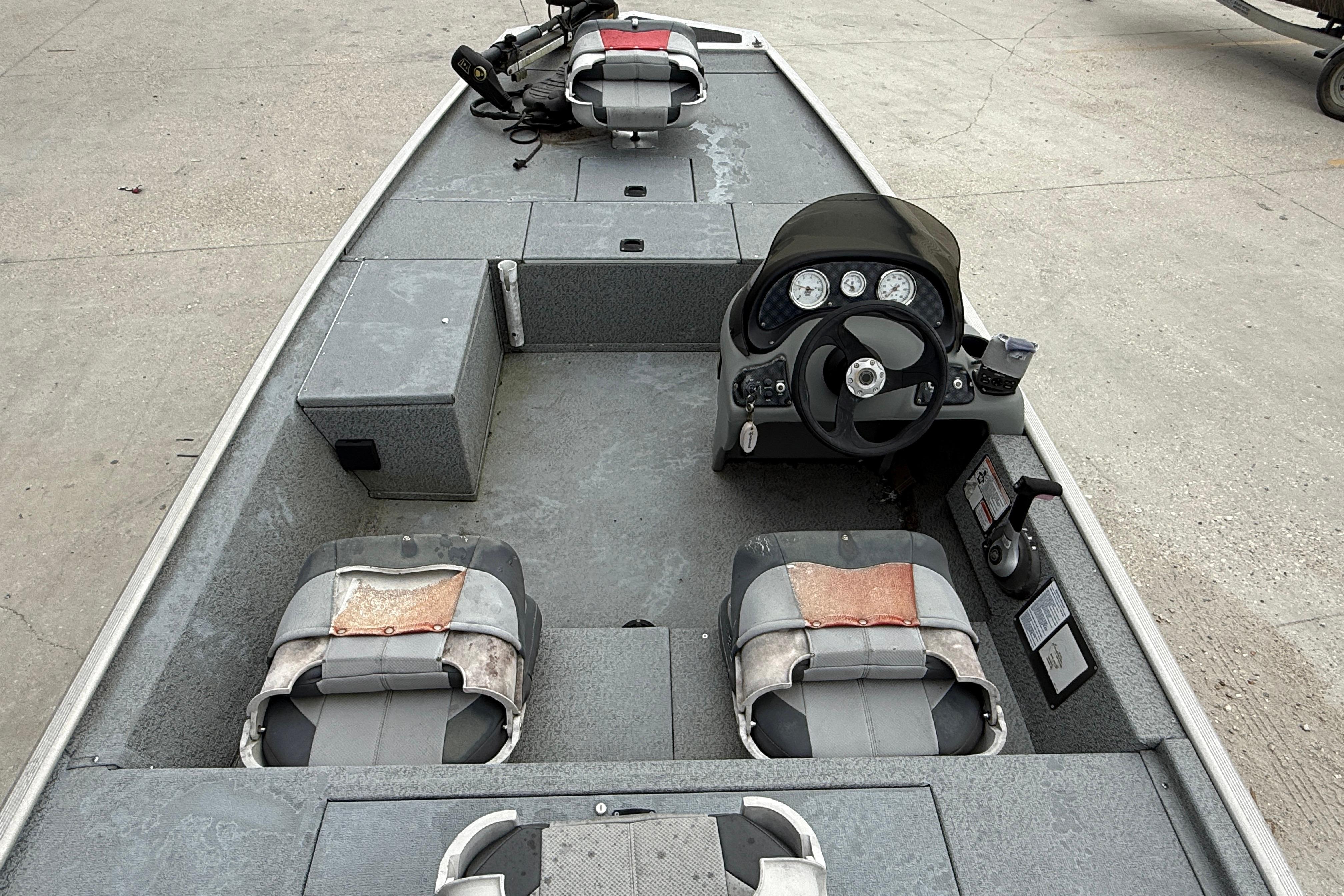 2016 Tracker Pro 170 boat interior with steering console and seating.
