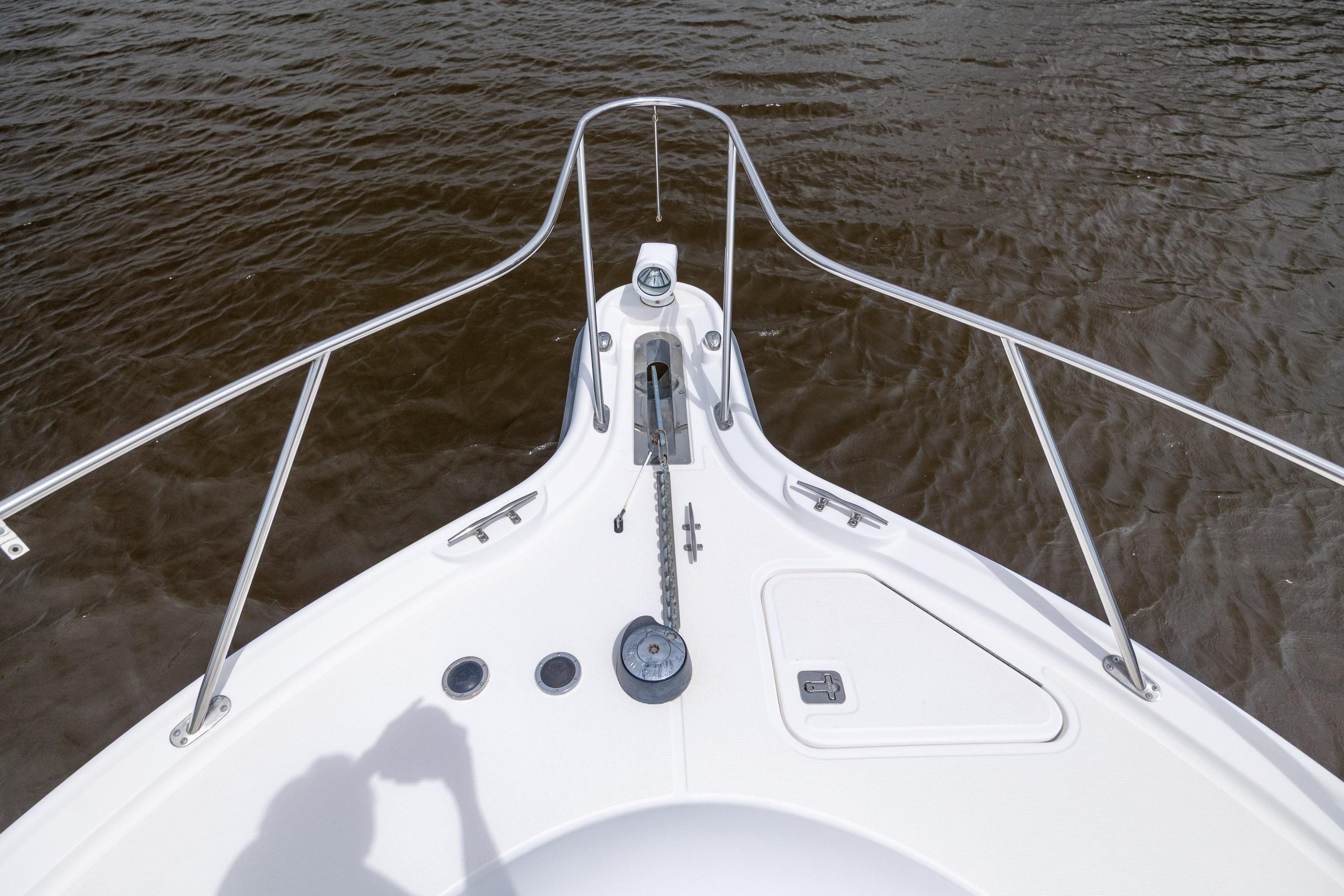 Bow view of 2004 Tiara Yachts 3200 Open on water.