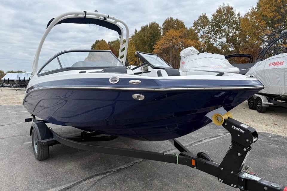 2026 Yamaha Boats 195S on trailer, sleek design, blue hull, outdoor setting.