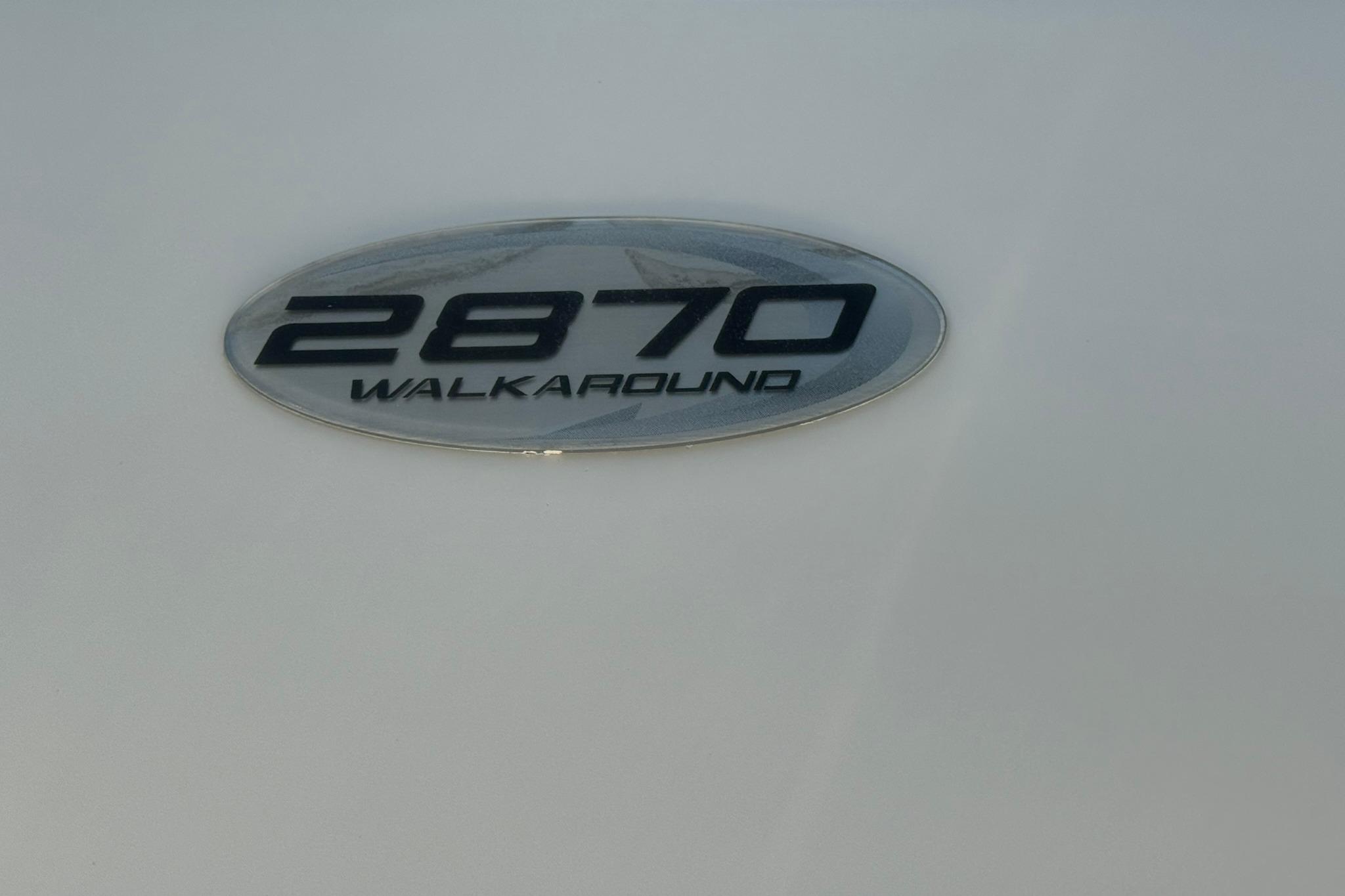 Emblem of 2003 Pursuit 2870 Walkaround boat on a white surface.