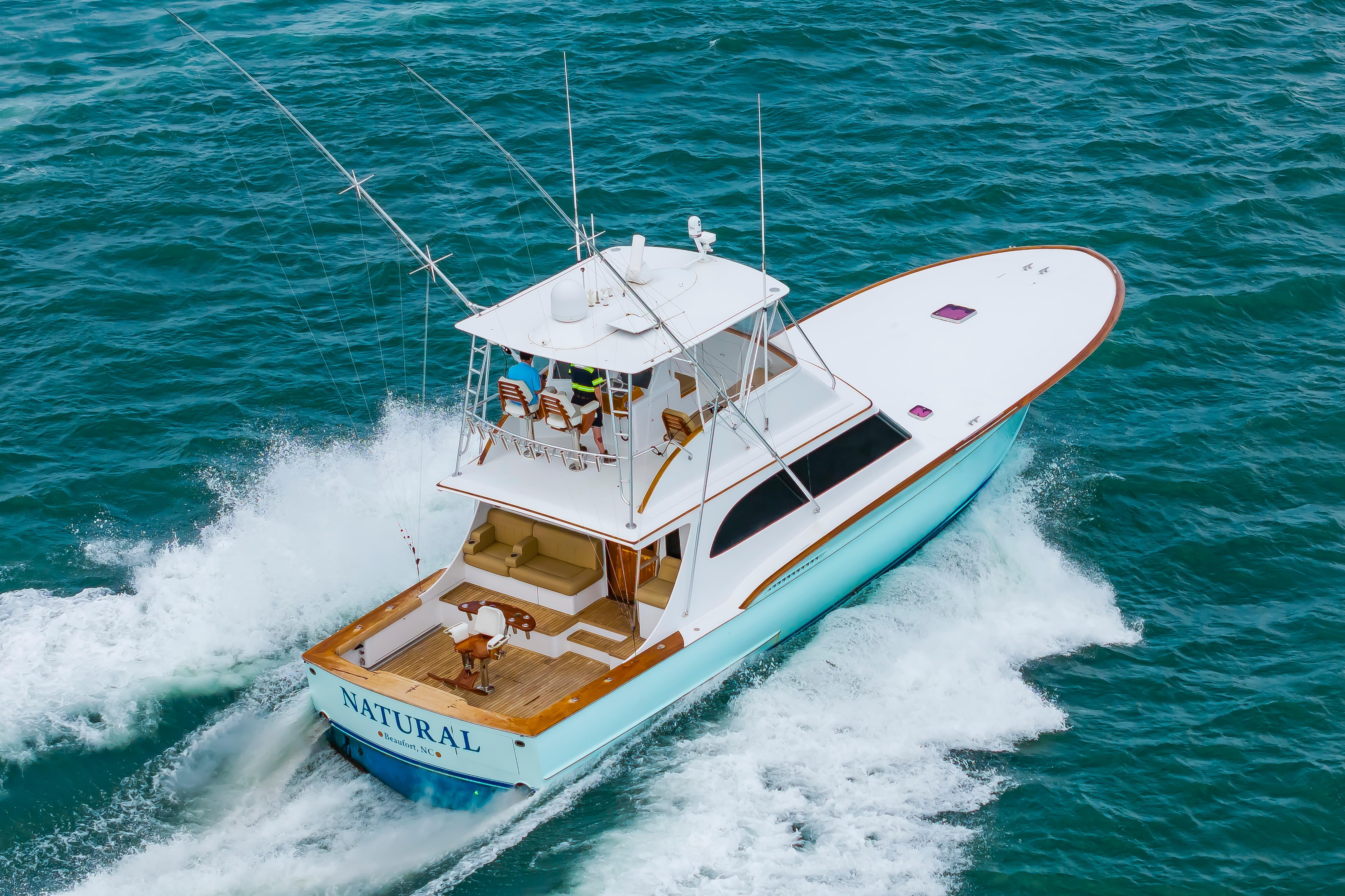Custom Carolina Scarborough 56 Convertible yacht cruising on open water, 1993 model.