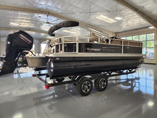 2025 Ranger 200C pontoon boat in showroom, featuring a Mercury outboard motor.