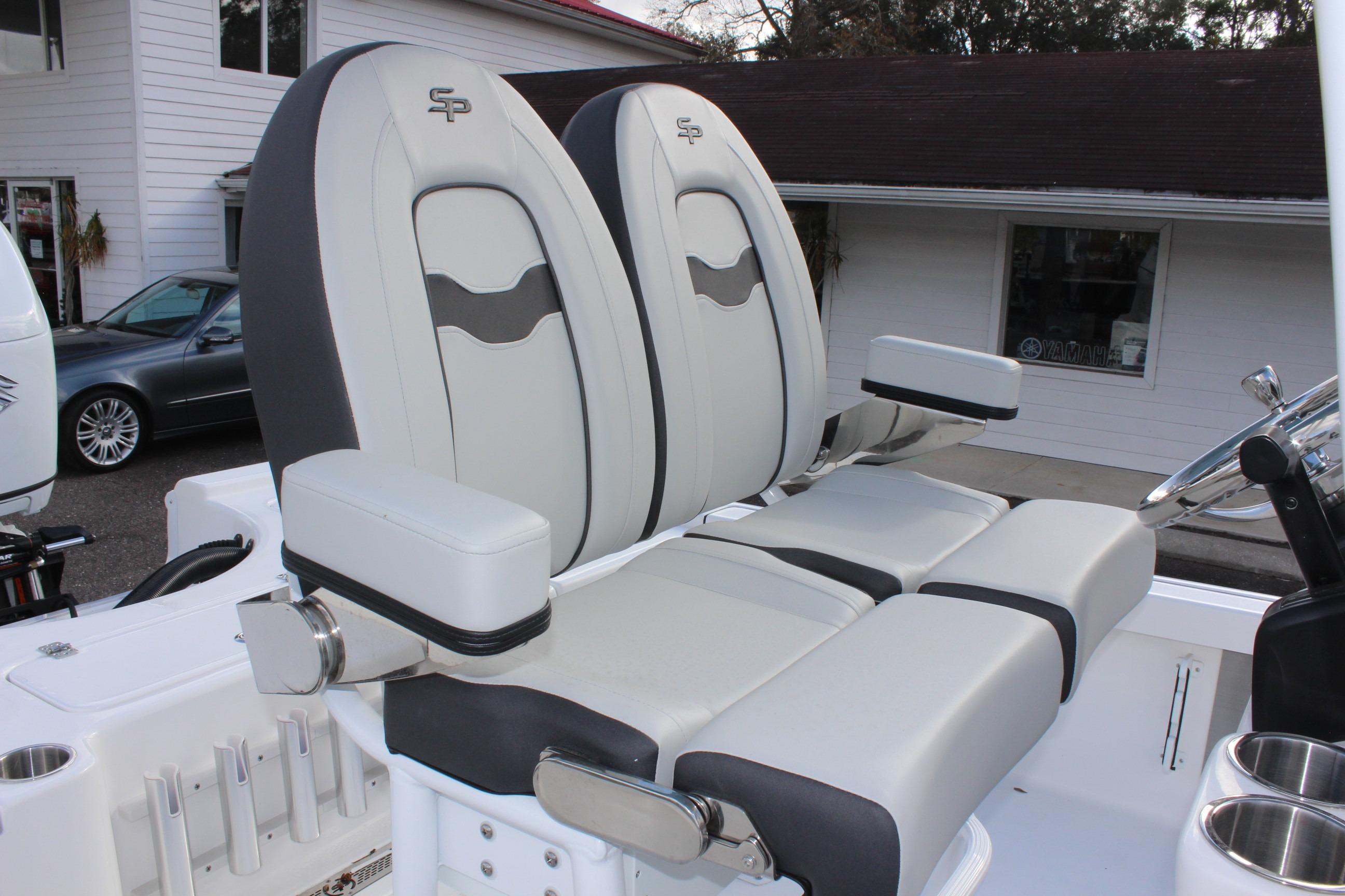 2025 Sea Pro 230 Bay boat seats with armrests and steering wheel.