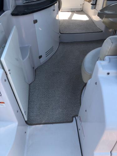 Interior of a 2008 Four Winns V338 with carpeted floor and seating area.