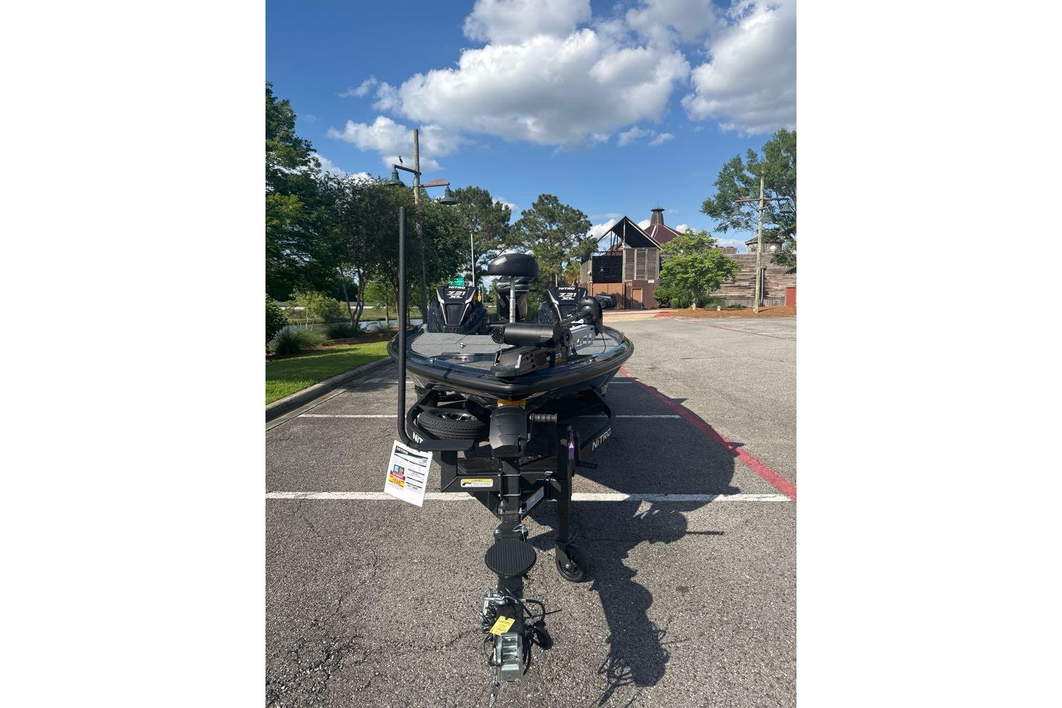 2026 Nitro Z21 XL boat parked outdoors under a clear blue sky.
