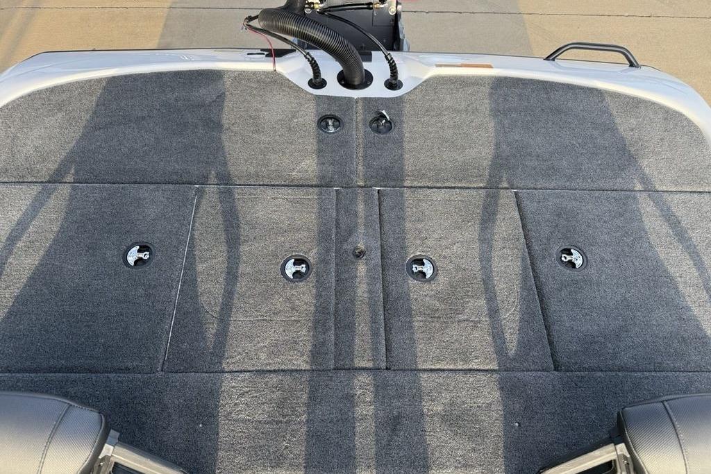 2026 Skeeter ZXR19 SE boat deck with gray carpet and storage compartments.
