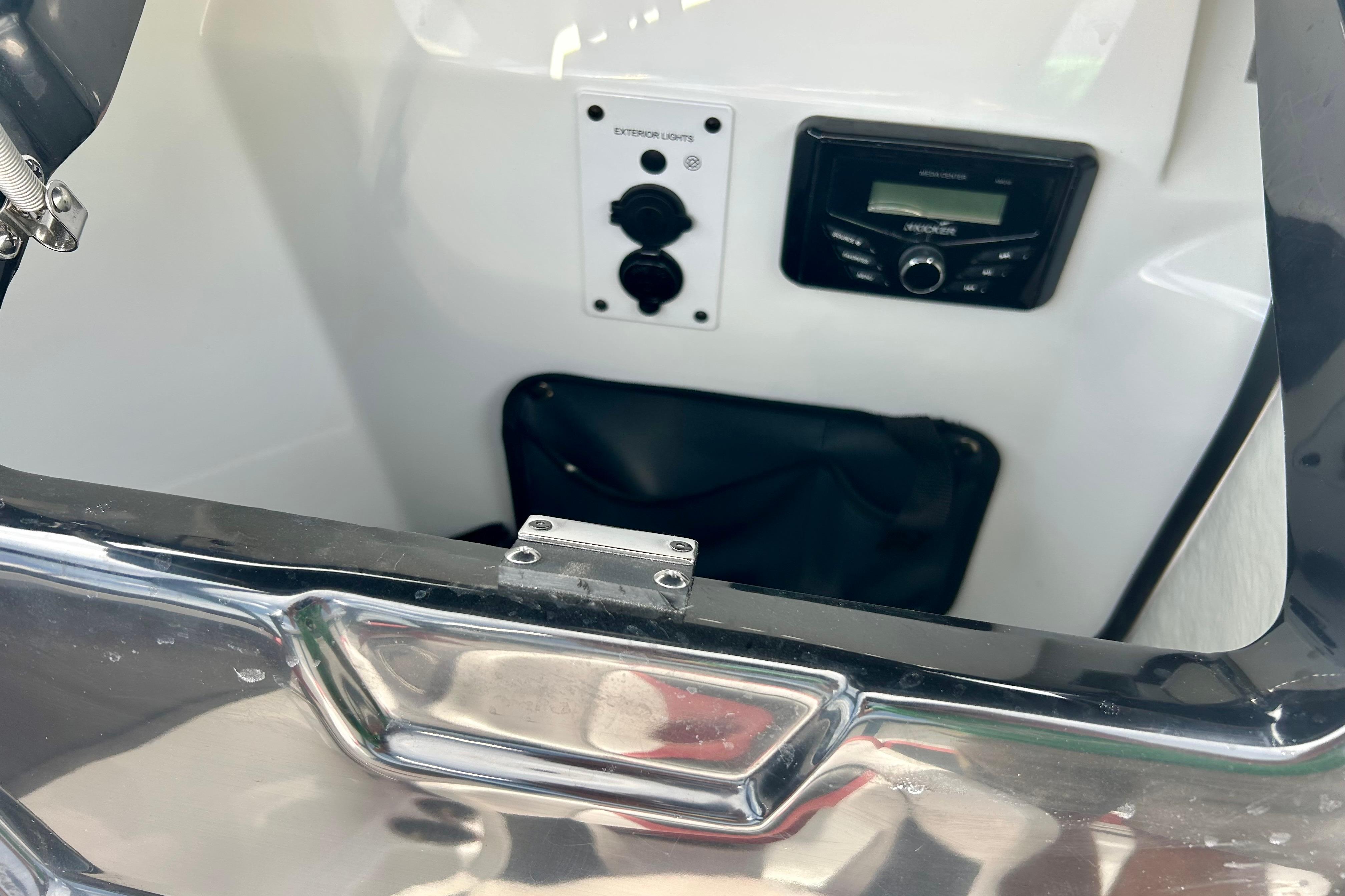 Interior view of a 2021 Scarab 195 ID boat featuring control panel and stereo system.