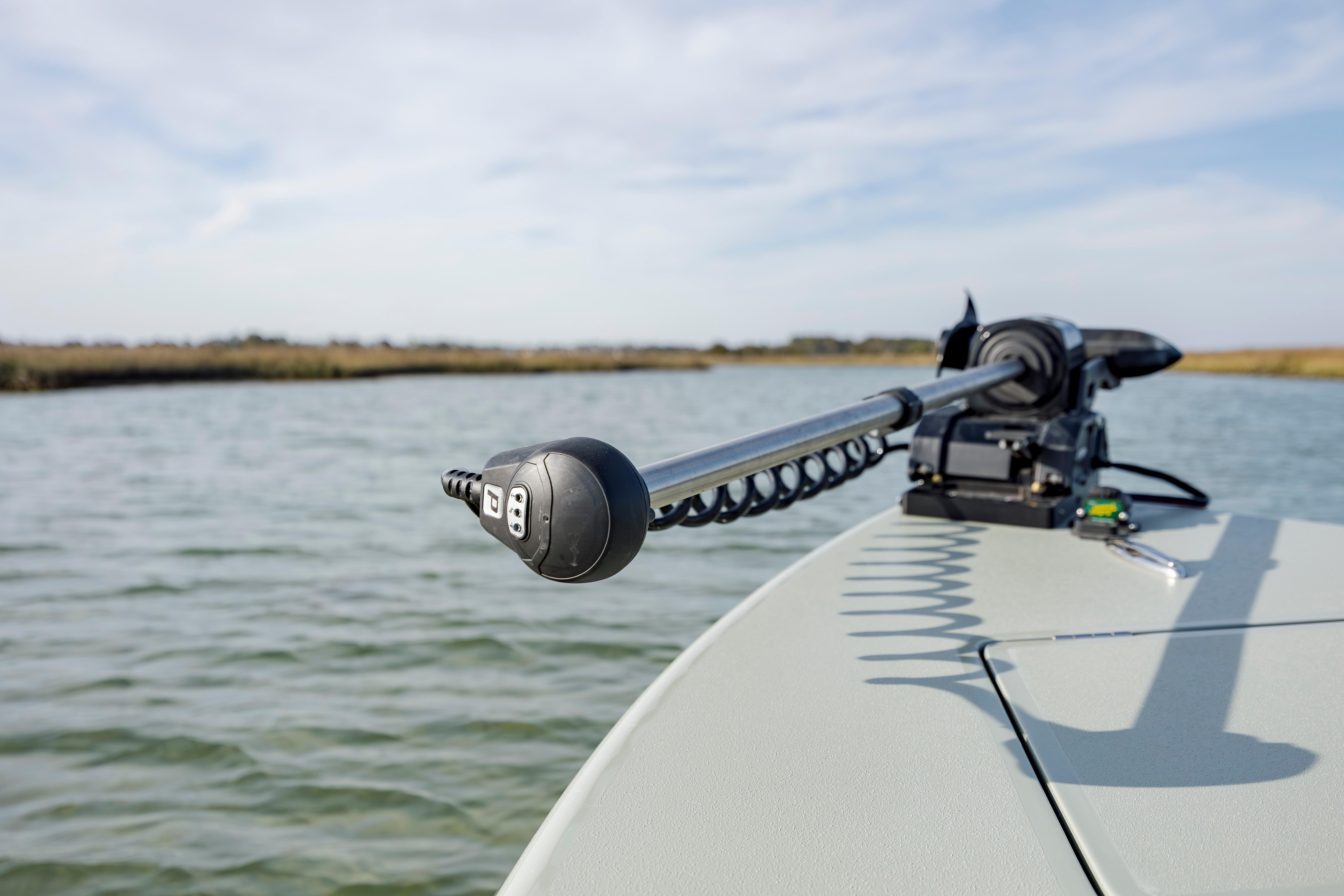 Trolling motor on a boat in calm waters, Vtech model 18, year 2025.