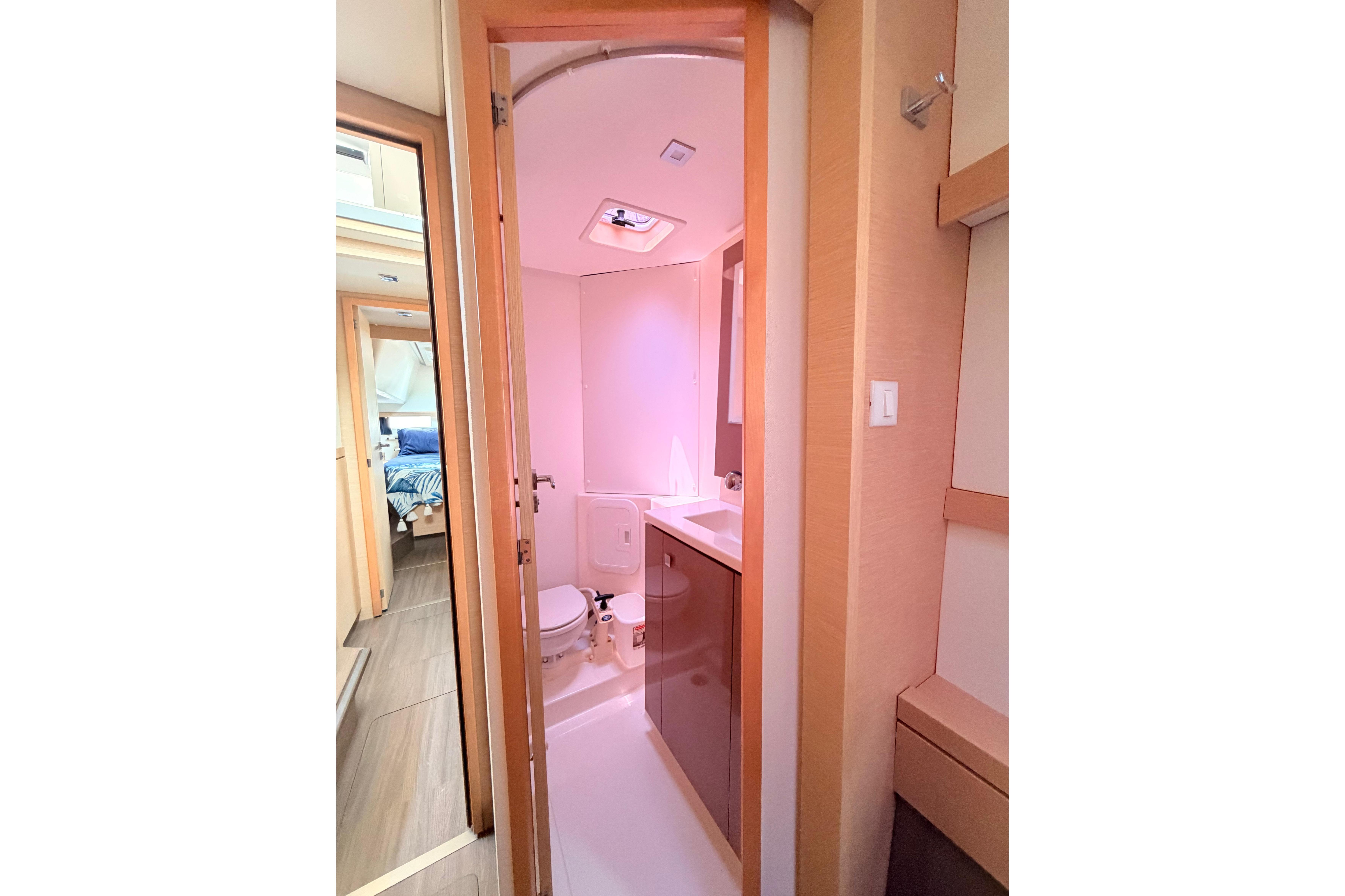 2018 Fountaine Pajot Lucia 40 yacht bathroom interior with modern fixtures and wood accents.