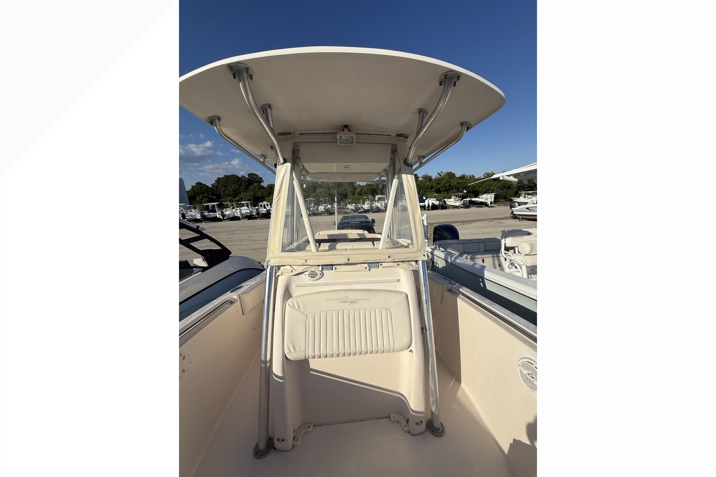 2011 Grady-White Fisherman 230 boat interior with T-top and console view.