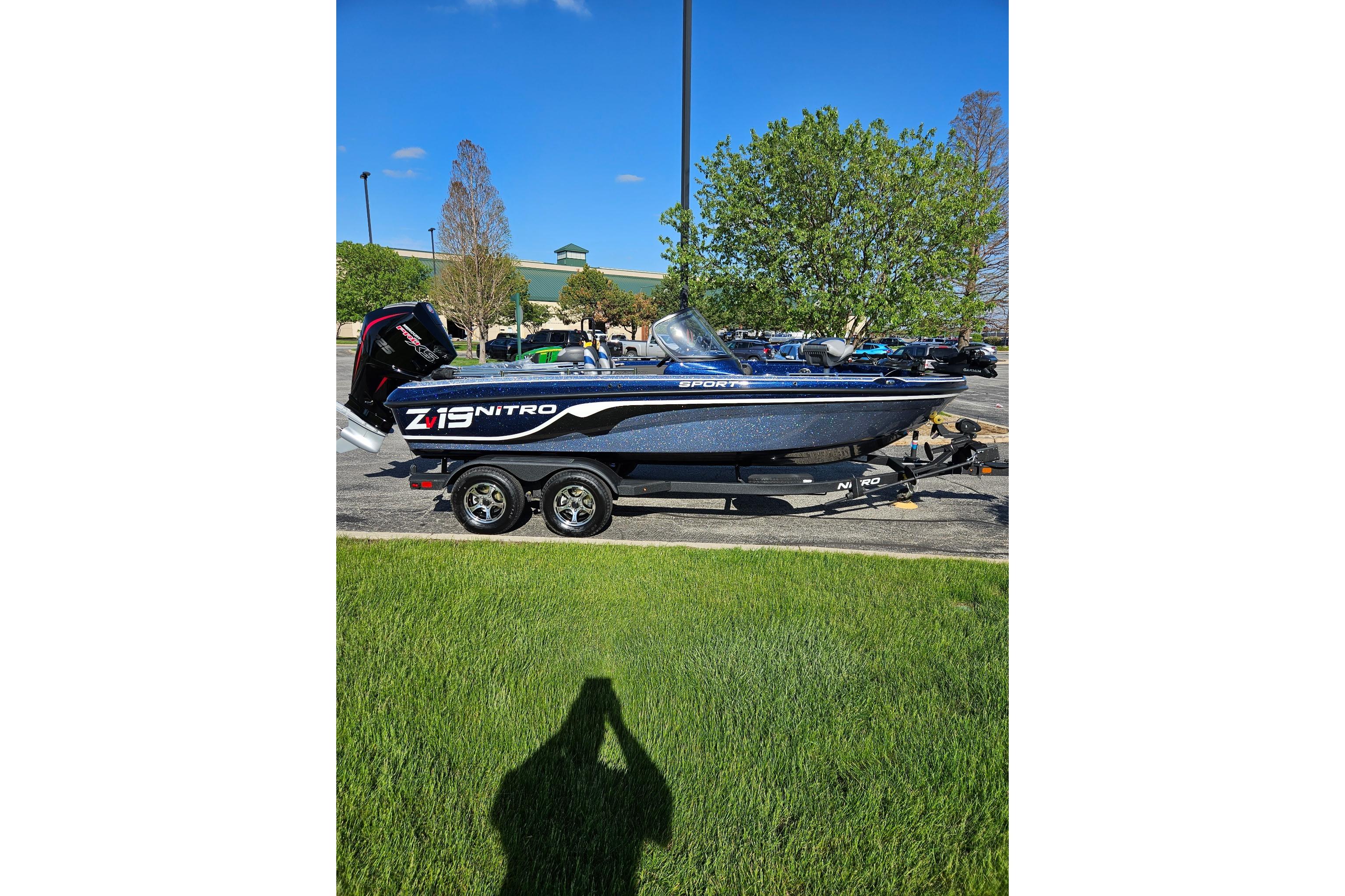 2026 Nitro ZV19 Sport Pro boat on trailer, parked outdoors on a sunny day.