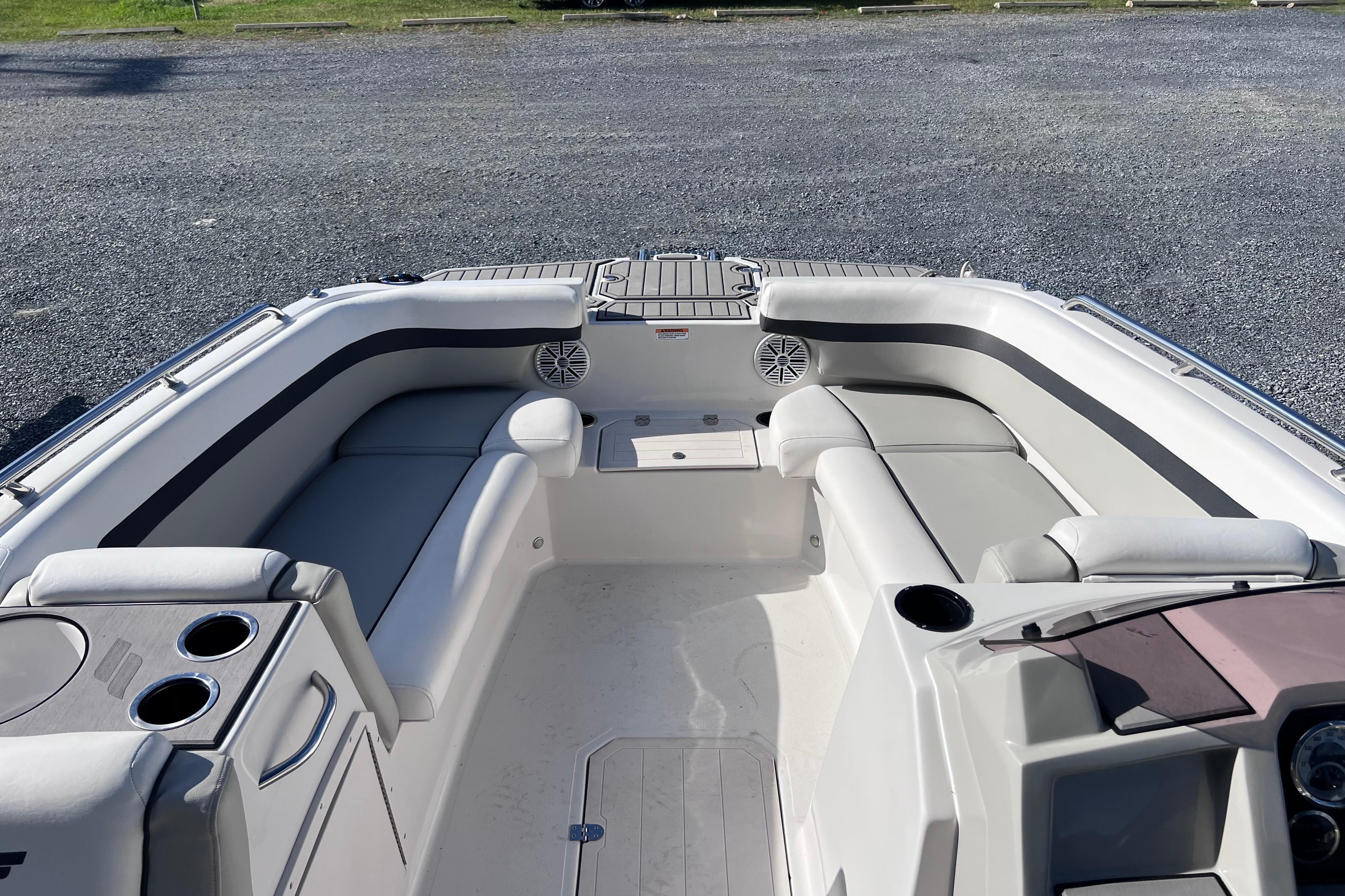 2021 Starcraft SVX 211 OB boat interior with spacious seating and cup holders.