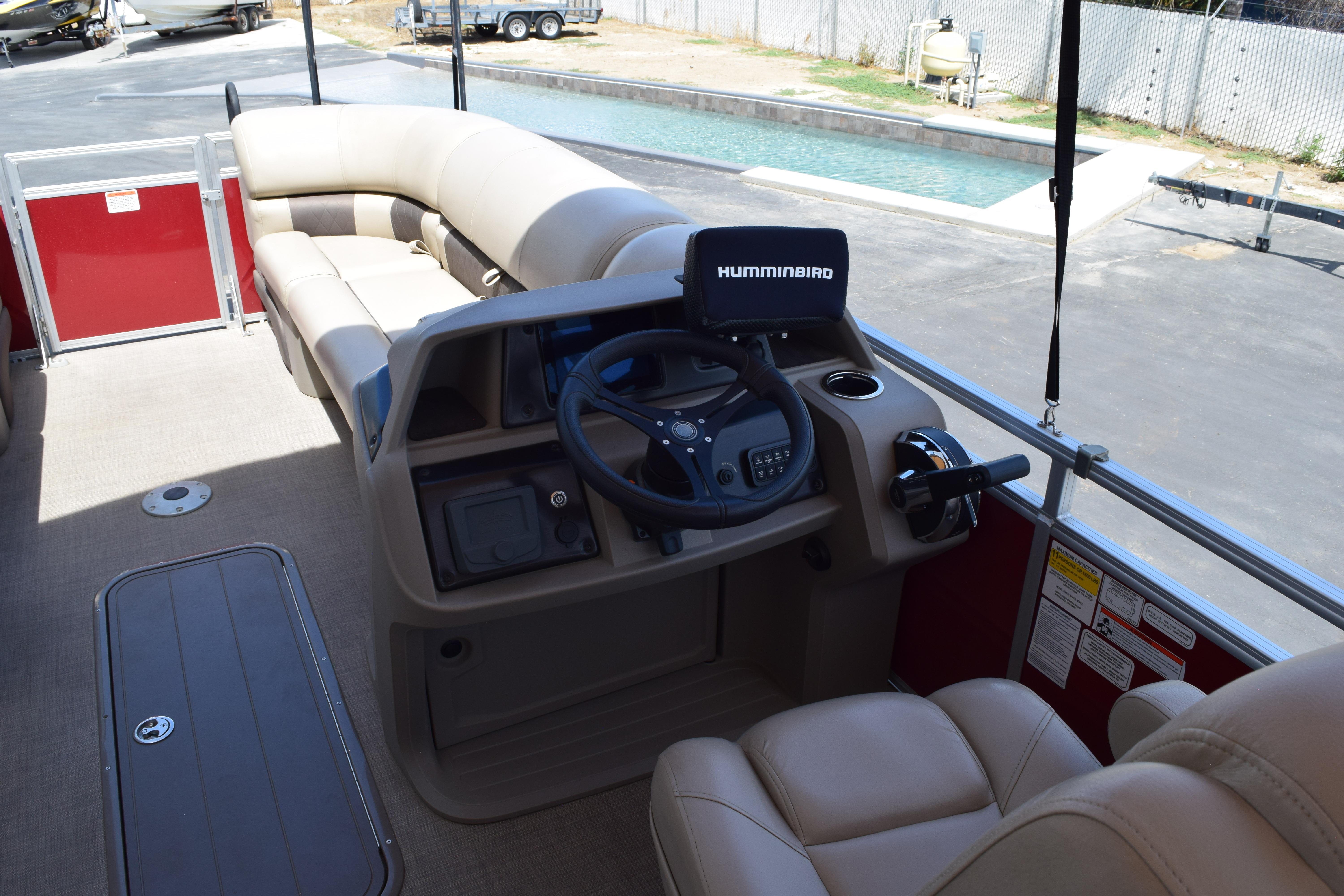 Interior of 2025 Sun Tracker Party Barge 22 XP3 with steering console and seating.