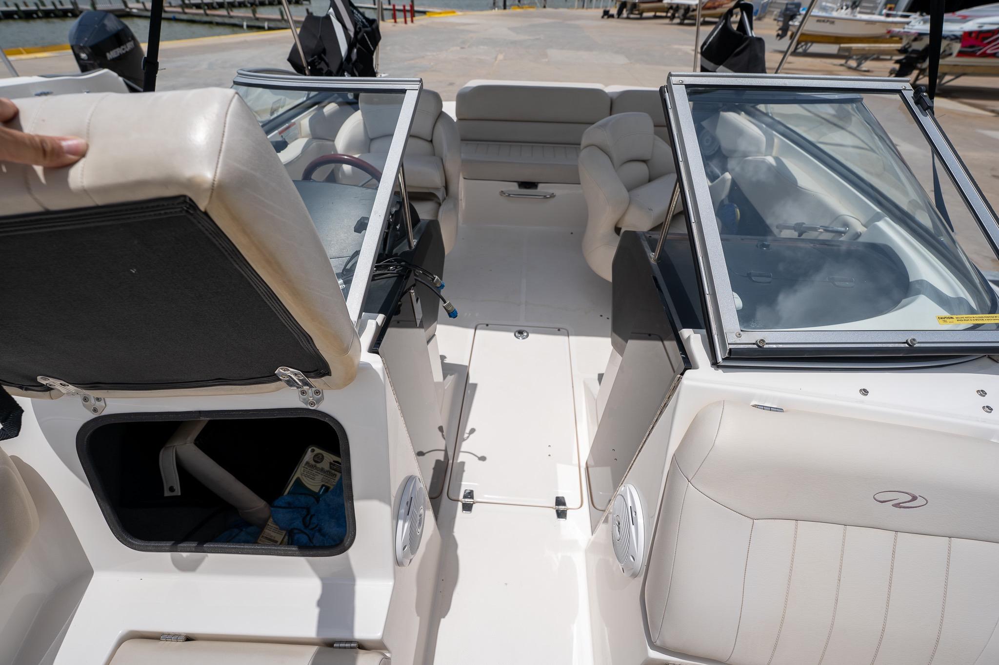 2008 Regal 2000 Bowrider interior with open storage compartment and seating.