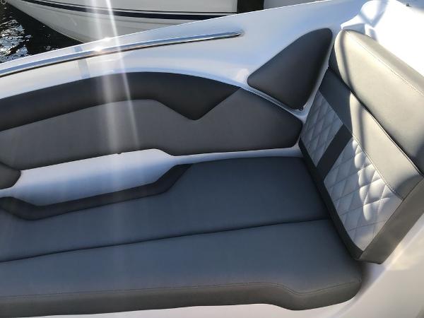 2020 Rinker 29QX BR boat interior with gray and black cushioned seating.