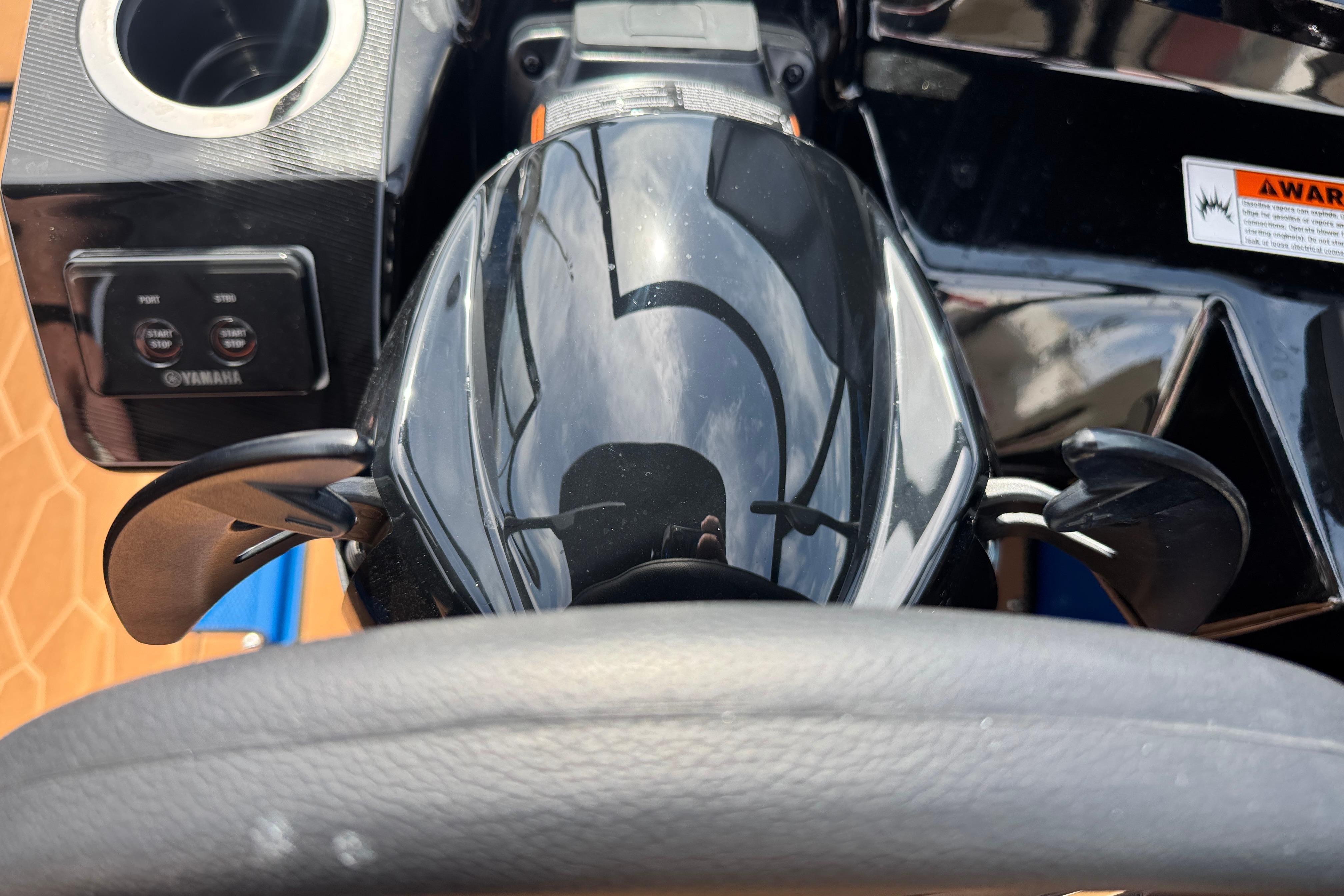 Close-up of 2026 Yamaha Boats 255XD steering wheel and controls.