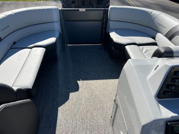 Interior of a 2023 Viaggio Lago 22U Tri Toon with gray seating.