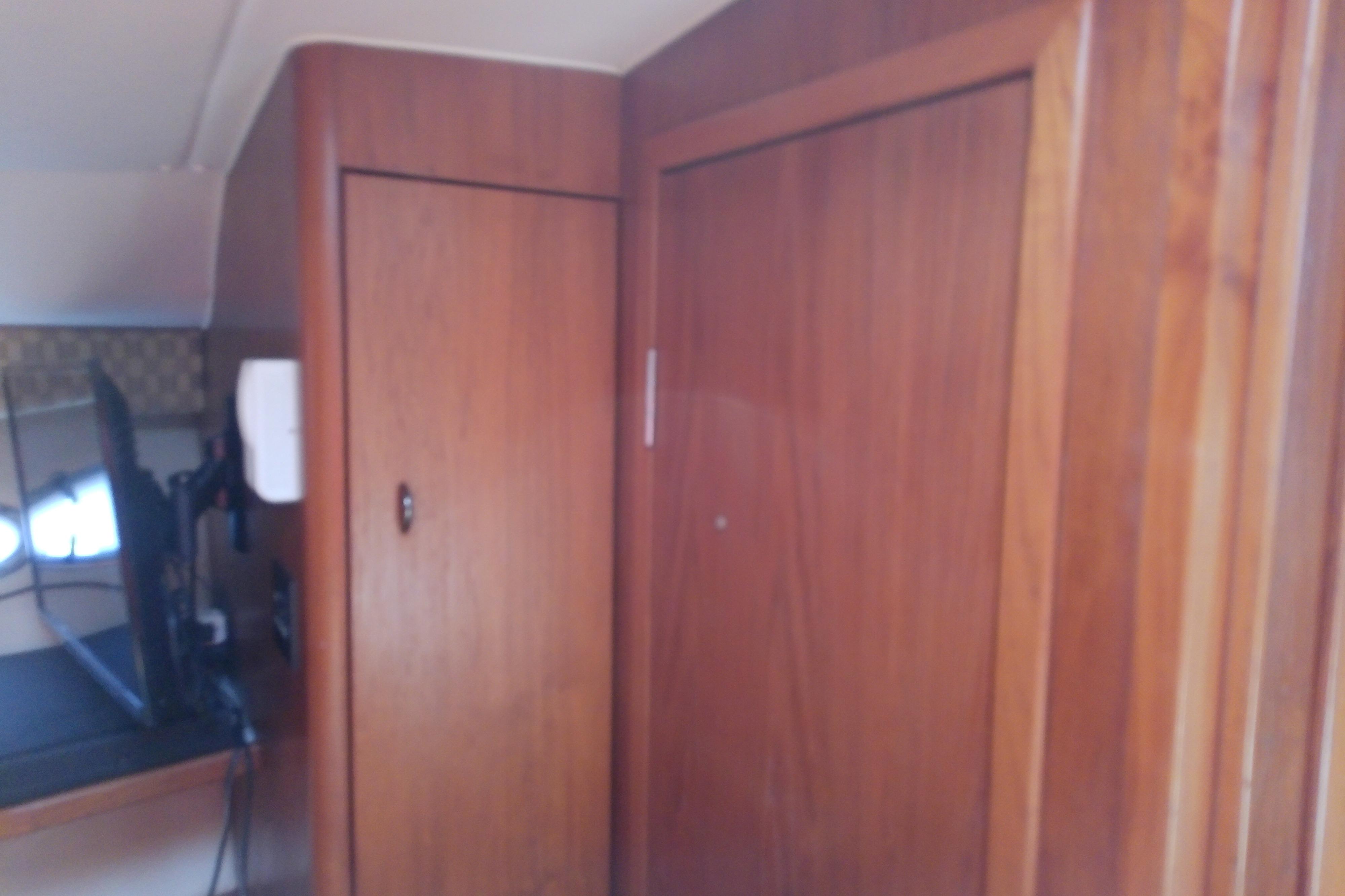 Interior view of 2000 Tiara Yachts 4100 Open with wooden cabinetry.