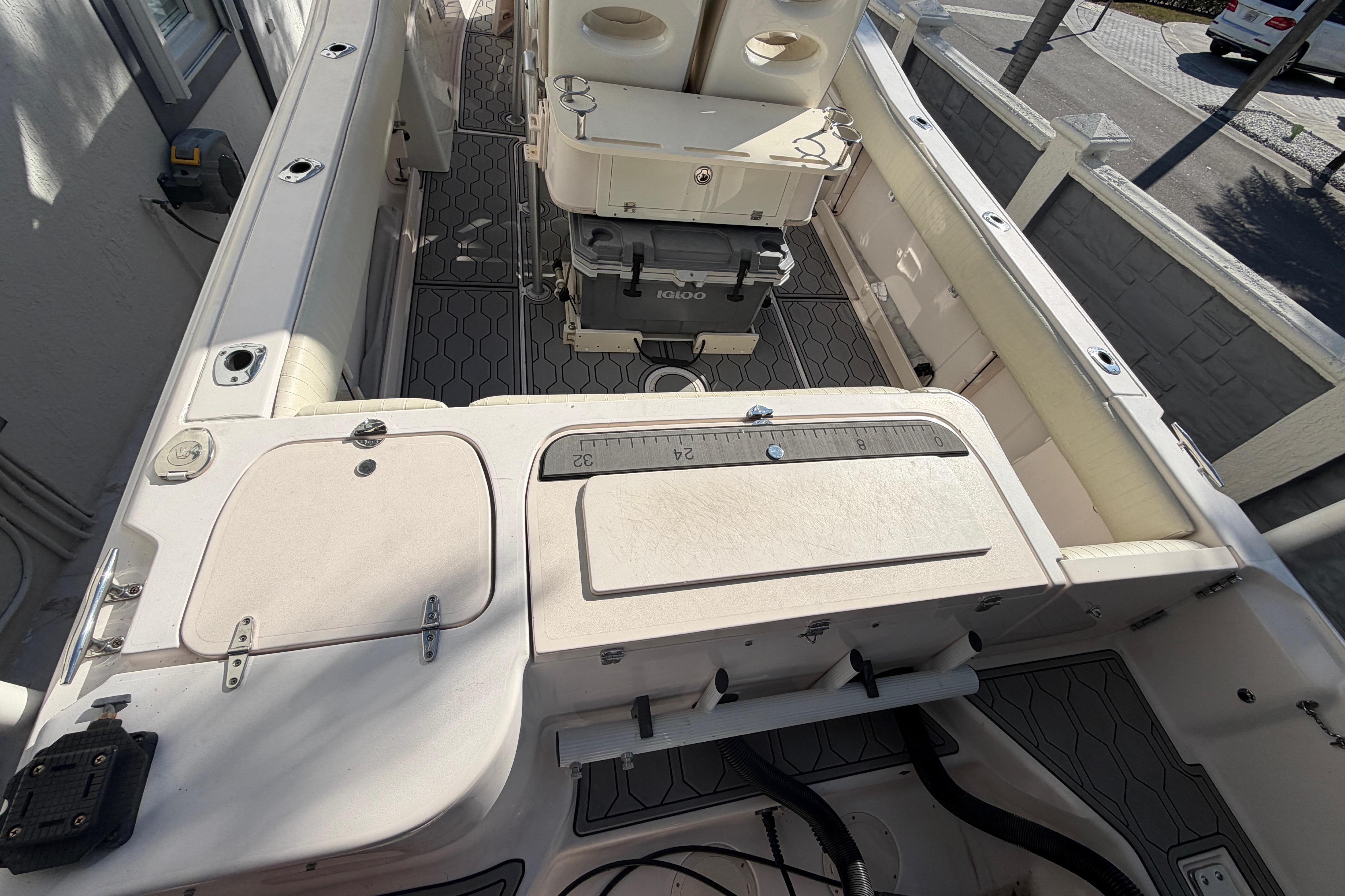 2004 Grady White 273 boat interior with storage compartments and equipment.
