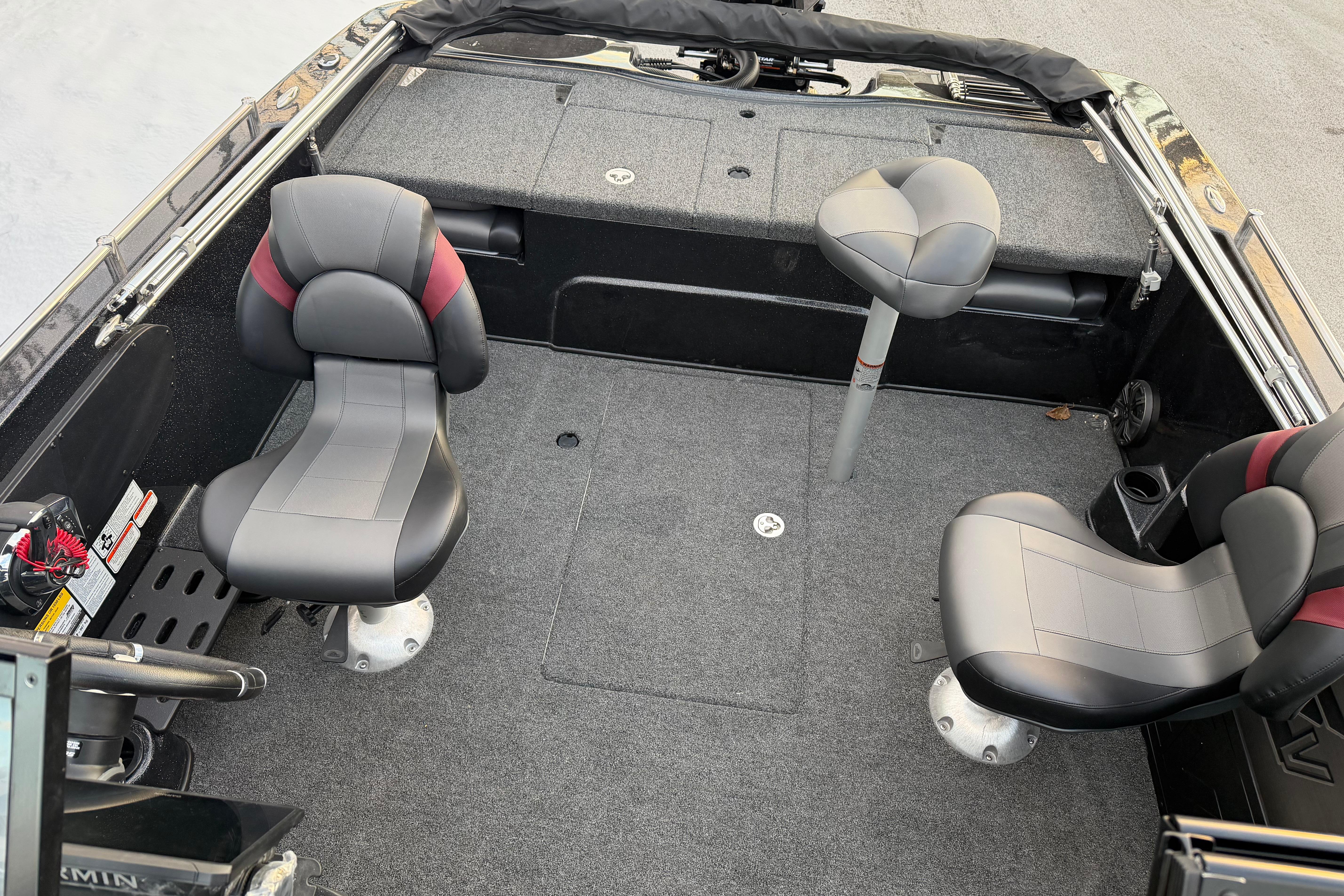 2026 Nitro ZV19 Sport Pro boat interior with three seats and carpeted flooring.