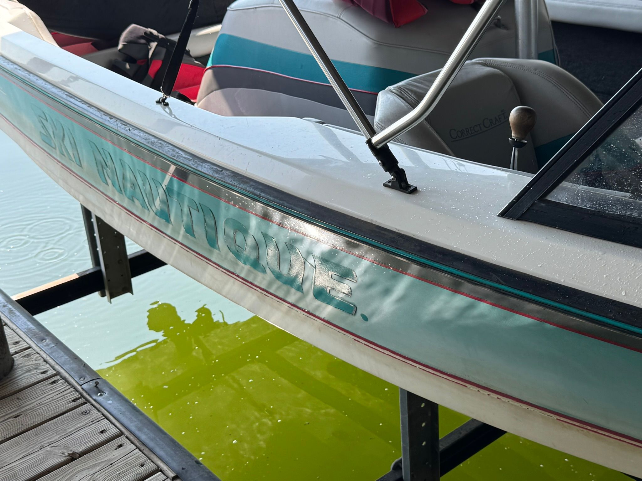 1991 Correct Craft Ski Nautique boat at dock.
