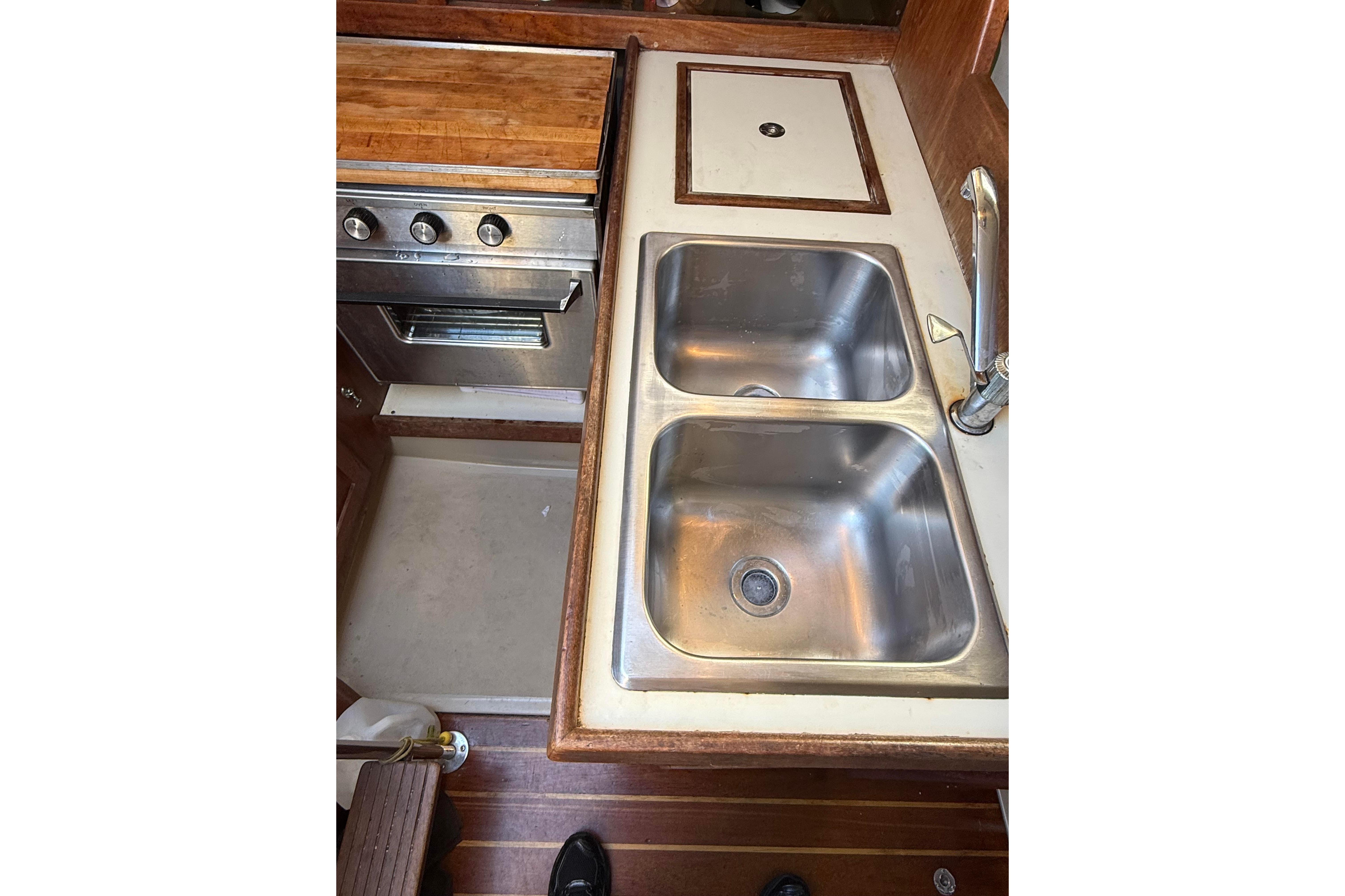 1983 O'Day 34 yacht kitchen with double sink and stove.