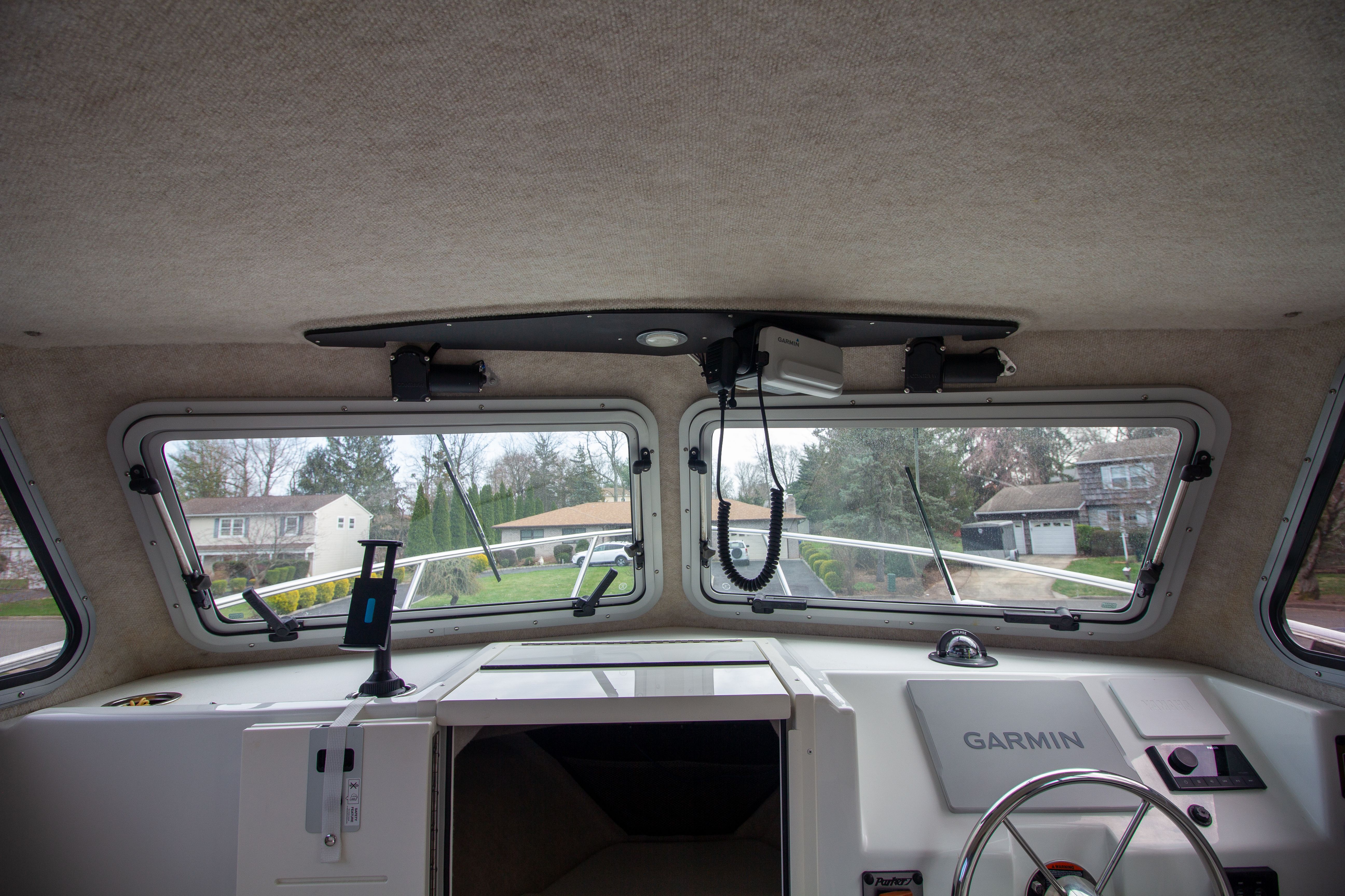 Interior view of 2022 Parker 2520 XLD Sport Cabin with Garmin controls.