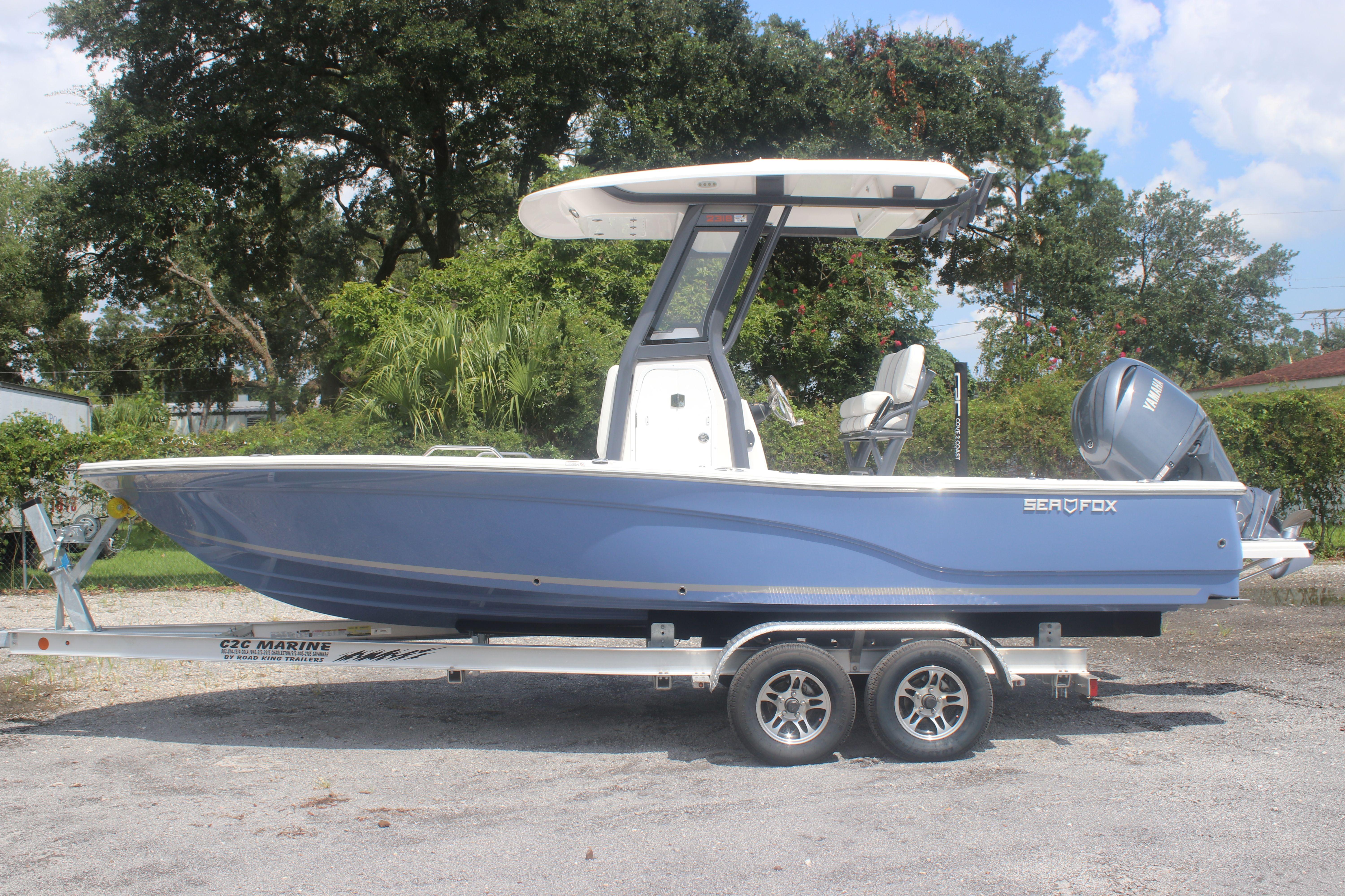 2025 Sea Fox 231 Bay Fox boat on trailer, side view, outdoors.
