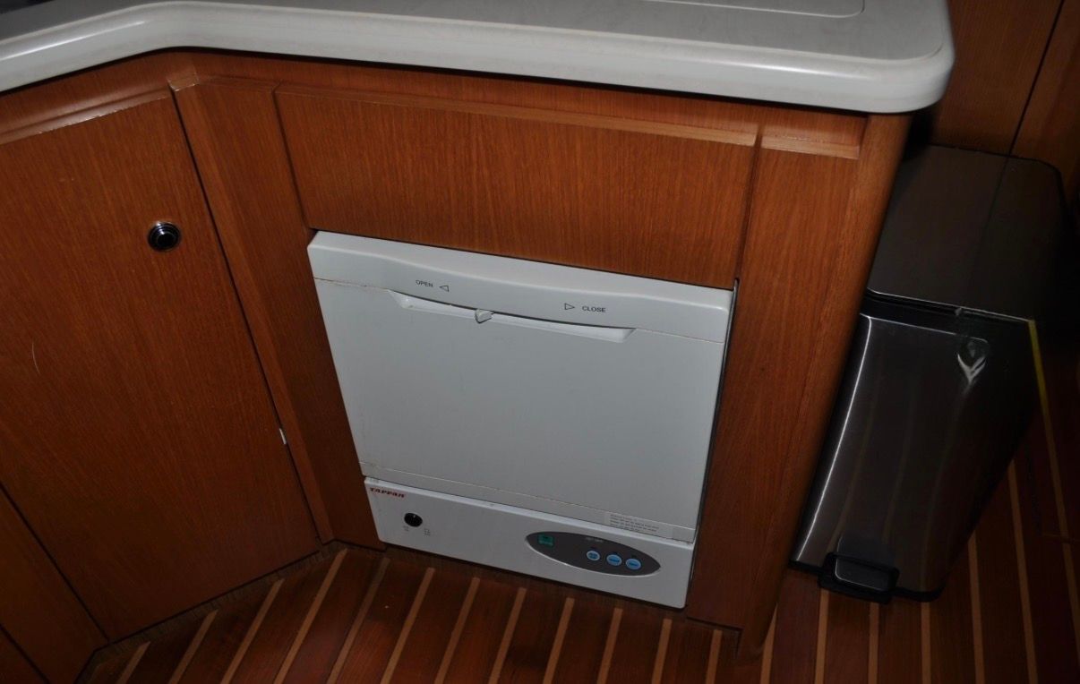 Interior of a 2005 Tiara Yachts 5200 Sovran featuring a built-in dishwasher.