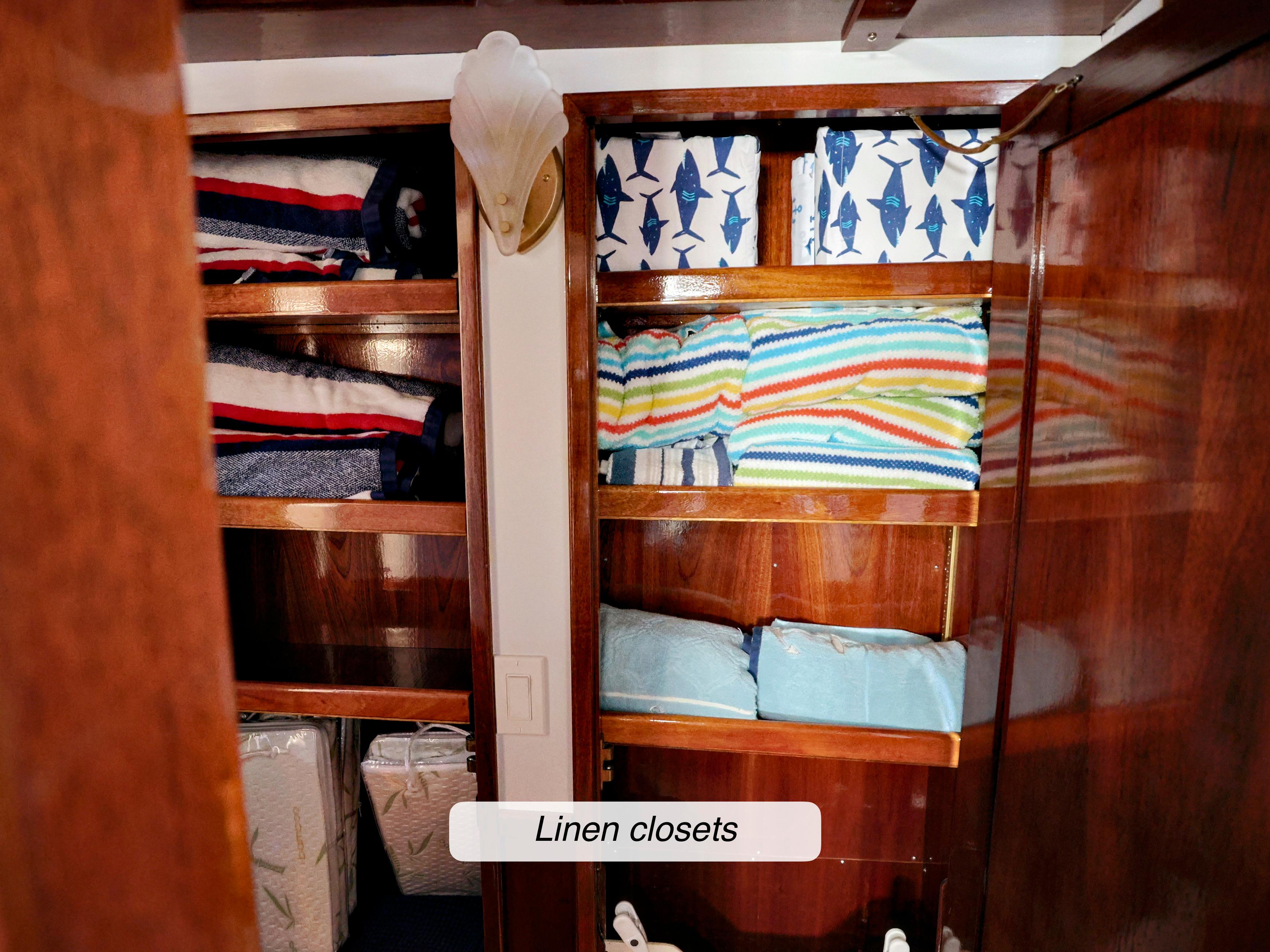Linen closets on a 1968 Stephens Motor Yacht, featuring neatly organized colorful linens.