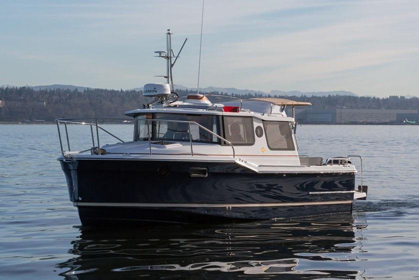 Manufacturer Provided Image: 2025 Ranger Tugs R-23 boat on calm water, showcasing sleek design and modern features.