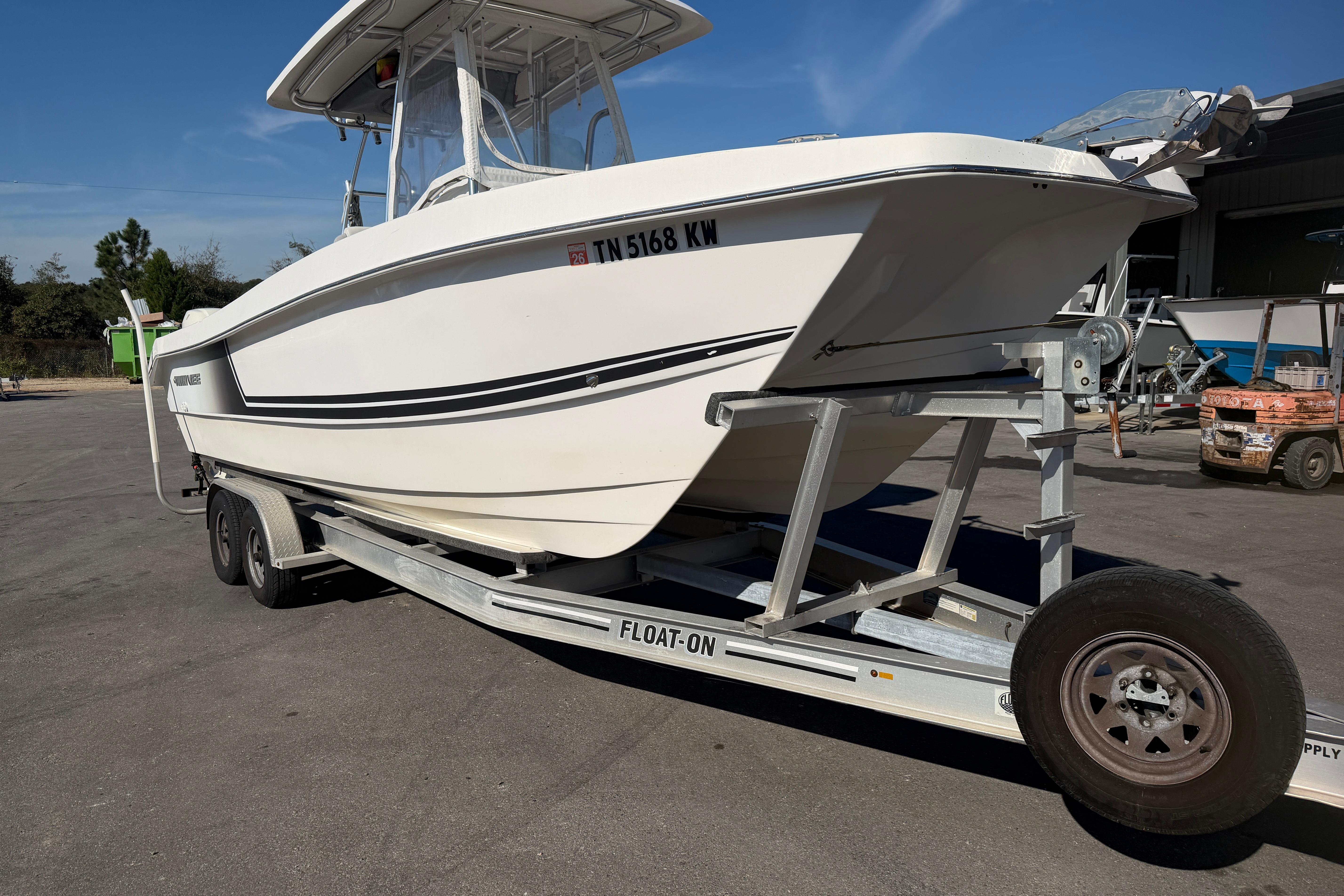 2018 Twin Vee 260 CC SE boat on trailer in outdoor setting.