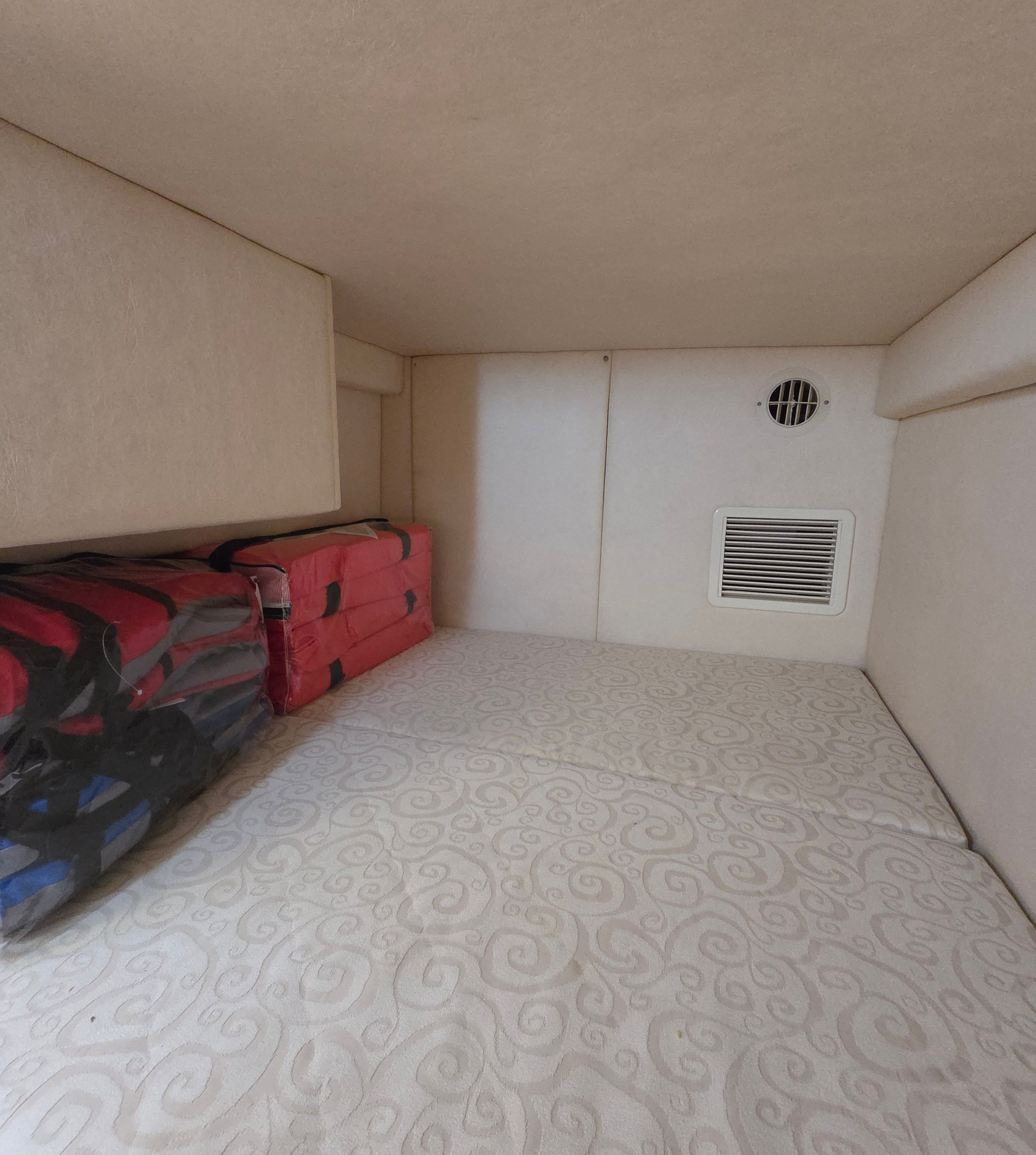 Interior of the 2005 Sea Ray Sundancer 260 with storage and ventilation.